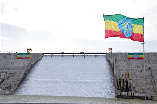 An Ethiopian flag flutters in the wind next to the Grand Ethiopian Renaissance Dam (GERD), built along the Blue Nile, during its inauguration, in Guba, Benishangul-Gumuz region, Ethiopia, September 9, 2025. REUTERS/Tiksa Negeri