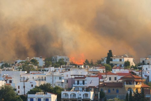 FILE PHOTO: Wildfire burns on the island of Rhodes