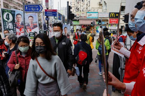 Supporters of candidates Jason Poon and Stanley Ng Chau-pei campaign during the Legislative Council election in Hong Kong