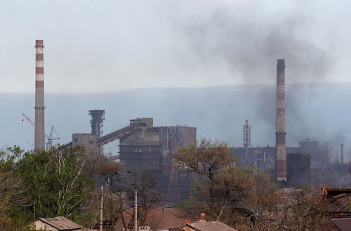 Smoke rises above a plant of Azovstal Iron and Steel Works in Mariupol