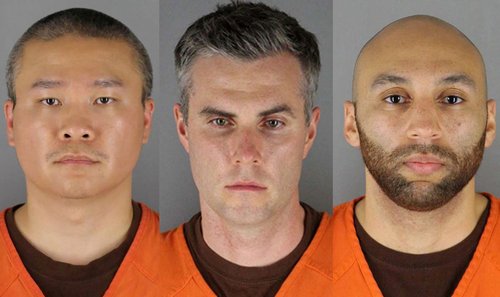 FILE PHOTO: Former Minneapolis police officers pose for booking photographs in Minneapolis