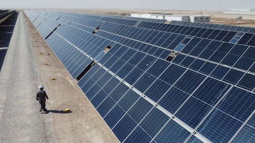 A general view shows solar panels, which are a part of the solar power project at the Faihaa oil field in Basra