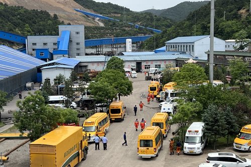 Rescuers work at the site following a gas explosion at Liushenyu coal mine
