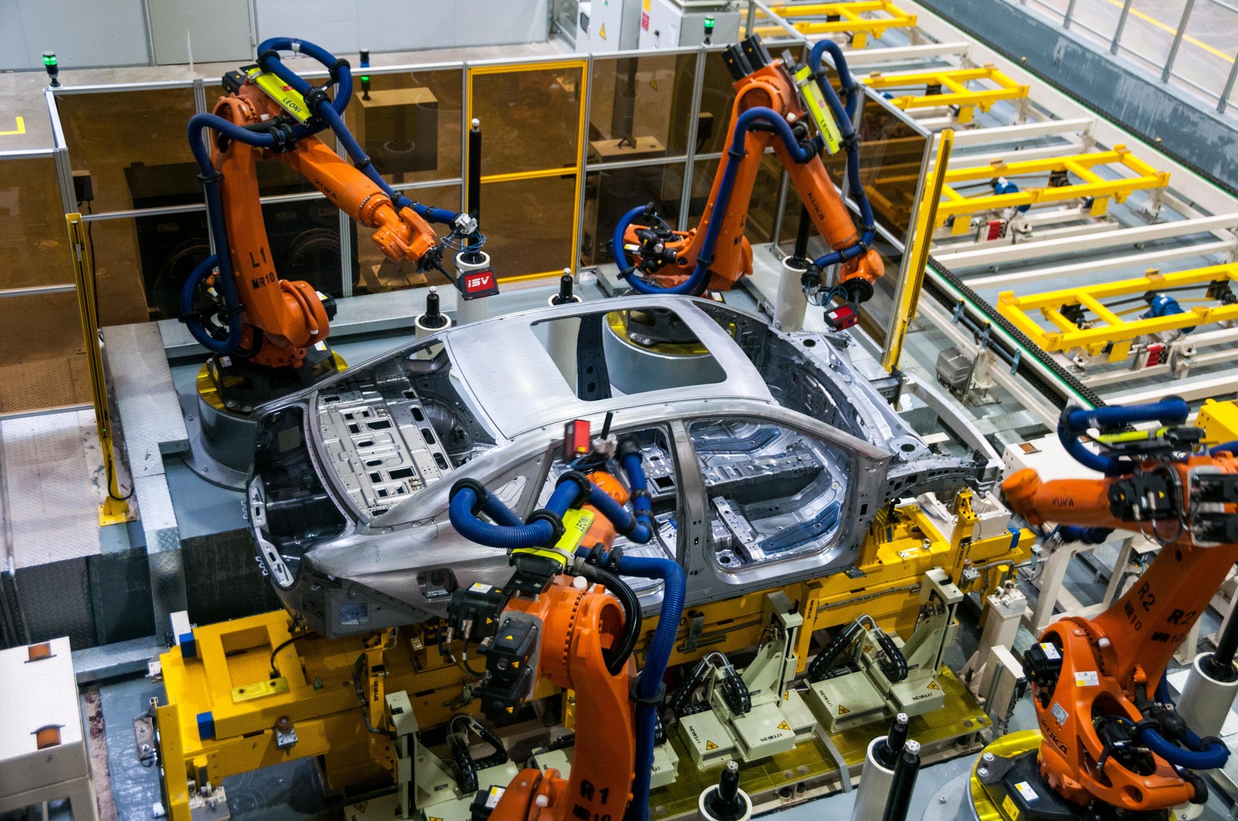 Guangzhou, China. 1st March, 2019. Robots working and measuring on the production line at the Guangzhou factory. Official launch of the GAC NE Aion S electric car billed as the Chinese Tesla Model 3 killer at the GAC NE factory in Guangzhou, Guangdong Pro