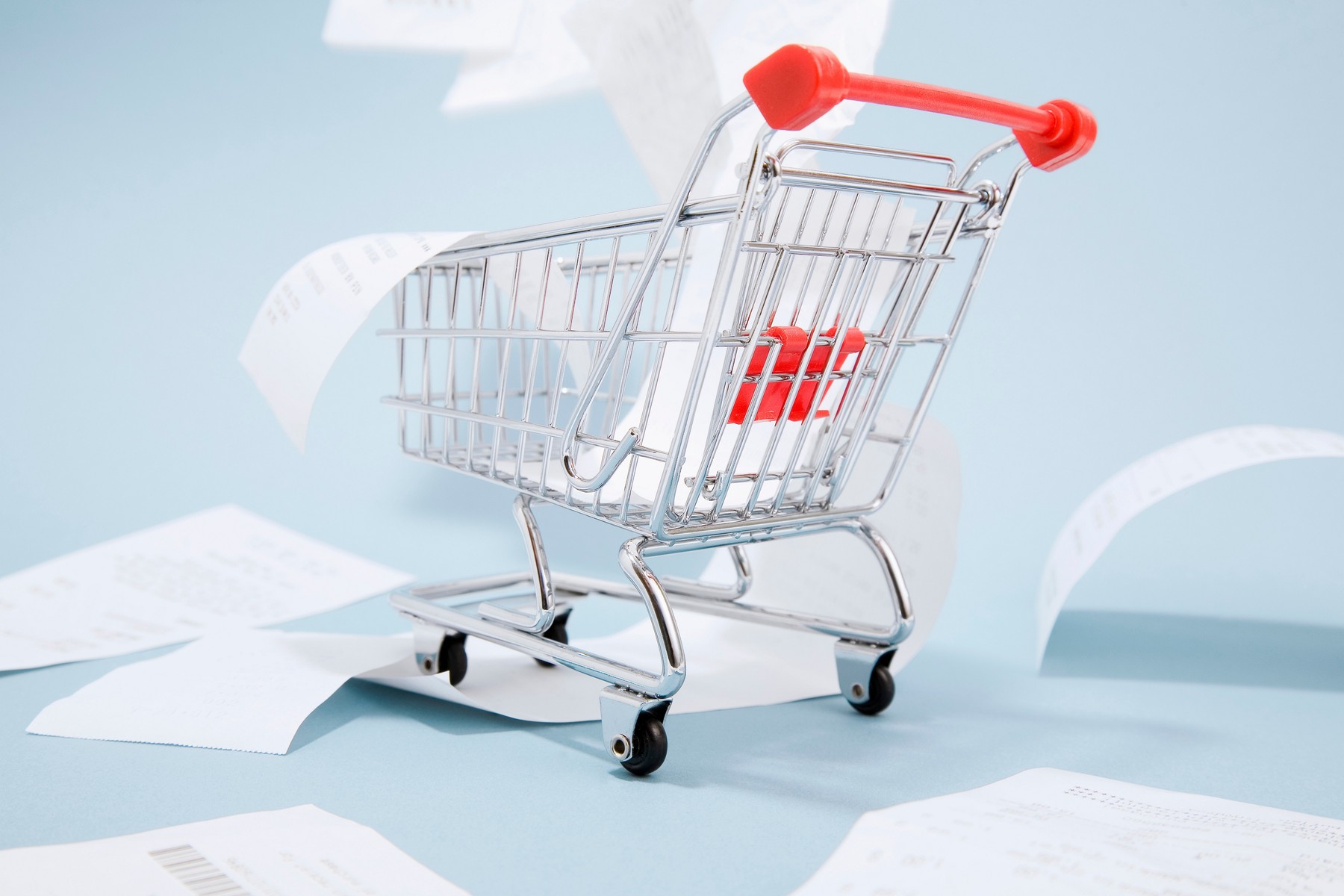 Receipts spilling out of shopping cart