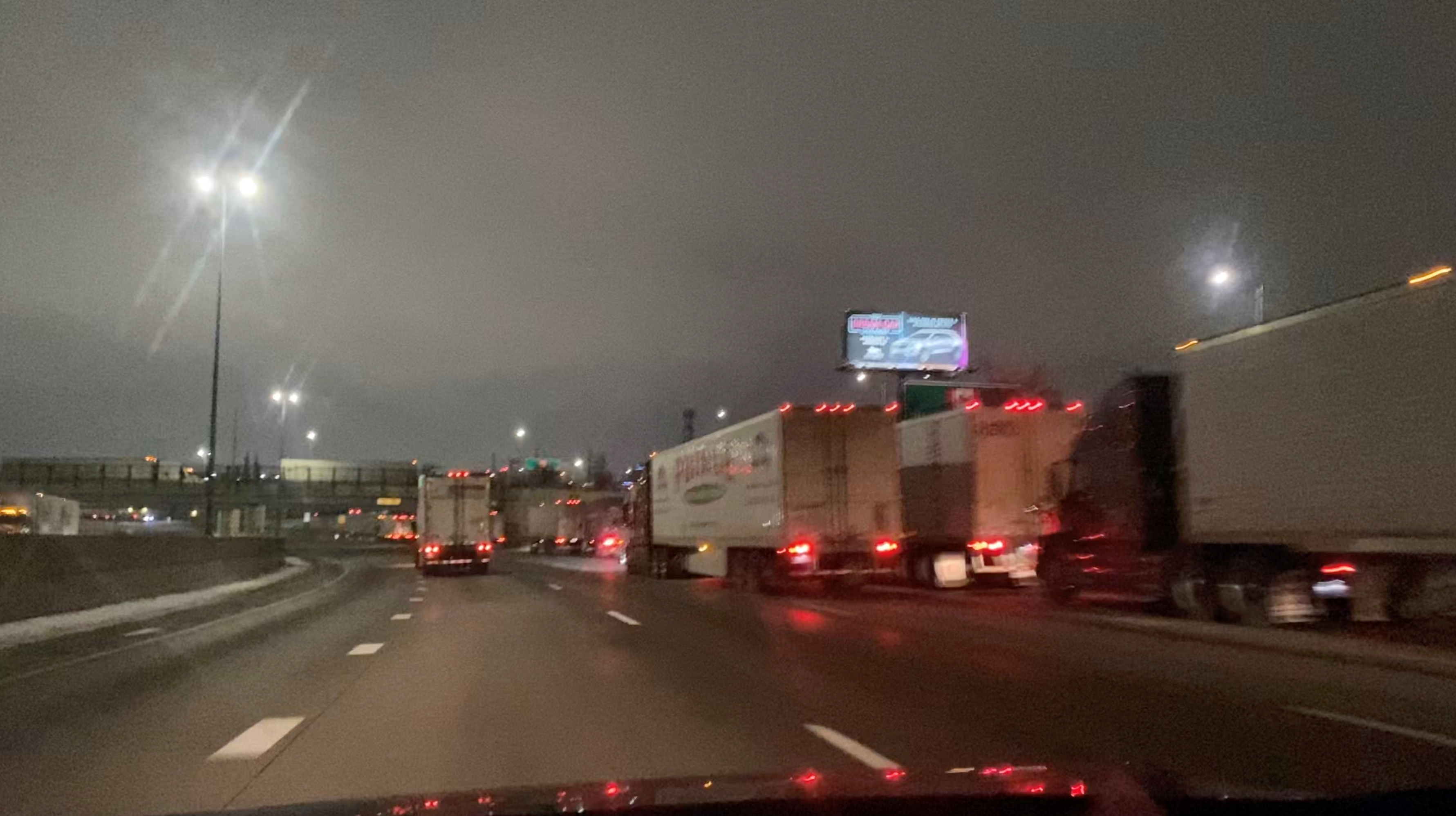 Truckers block the Ambassador Bridge on the I-75 and I-96 highways in Detroit