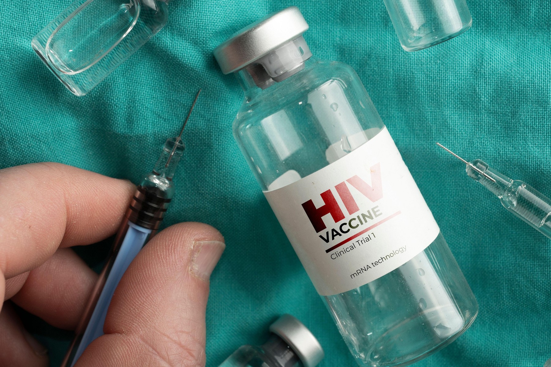 Hiv vaccine vials on a doctor' coat and an hand holding a syringe