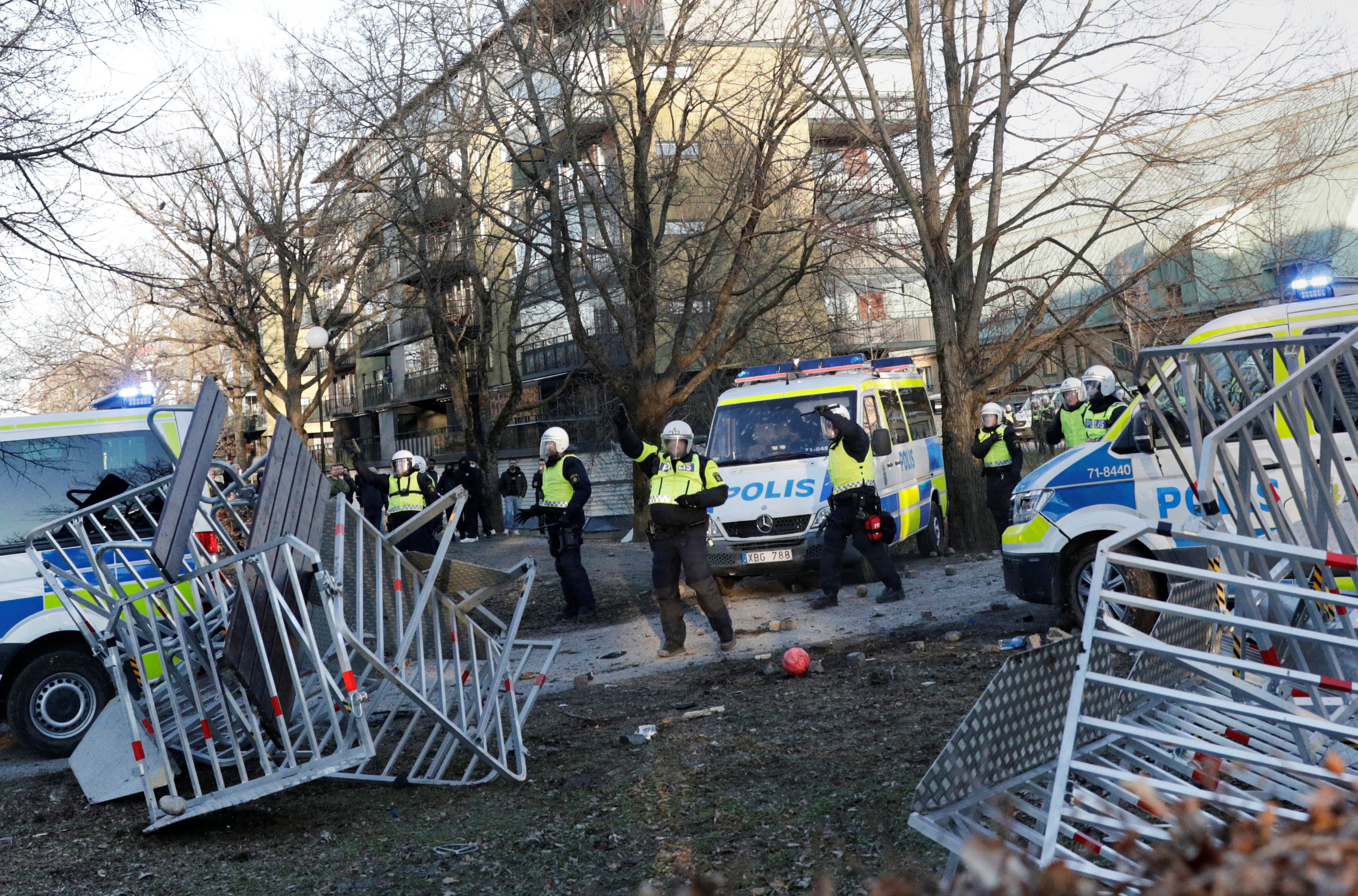 Police officers patrol during a protest ahead of a demonstration planned by Danish anti-Muslim politician Rasmus Paludan