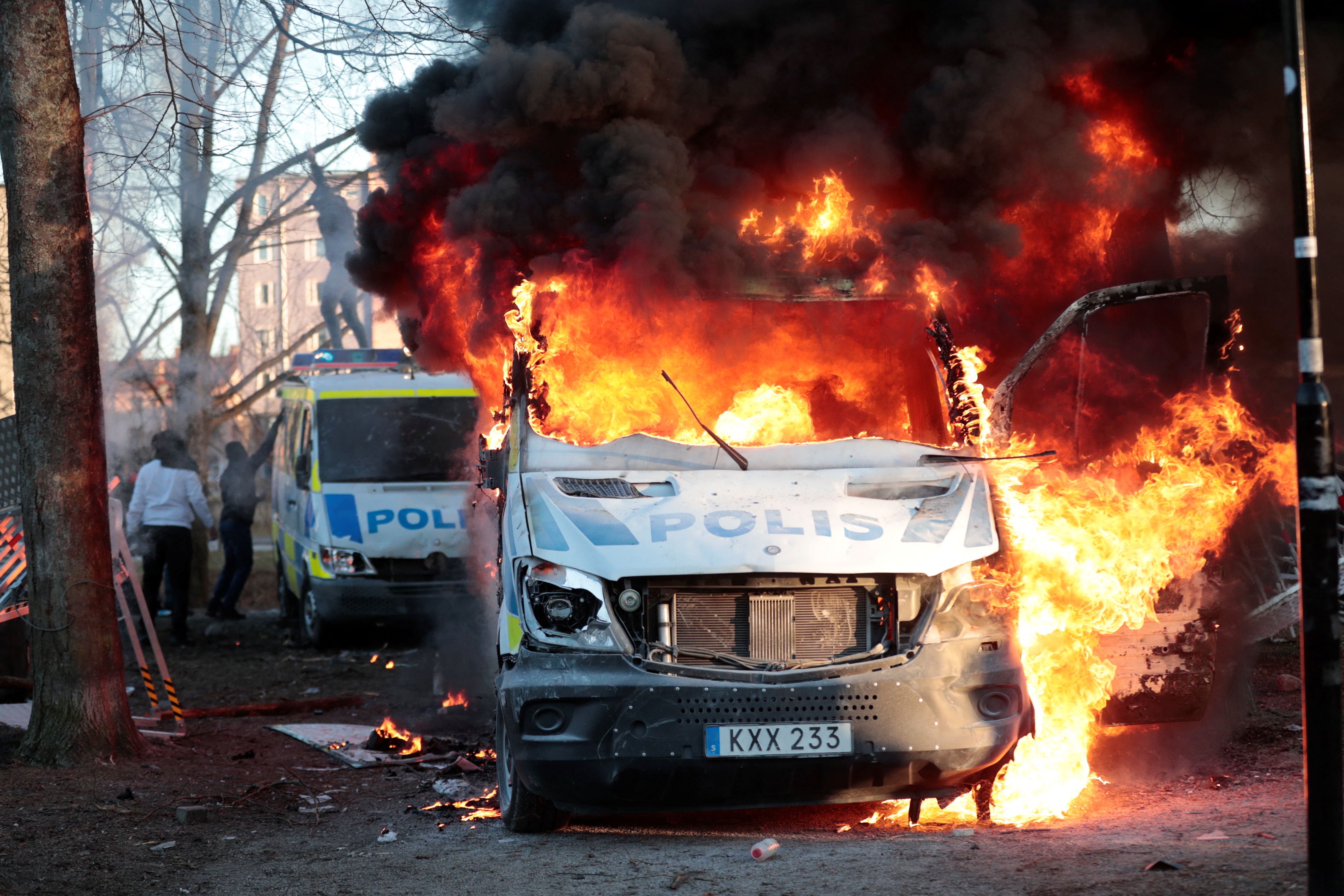 Counter-protesters set fire to a police bus ahead of a demonstration planned by Danish anti-Muslim politician Rasmus Paludan