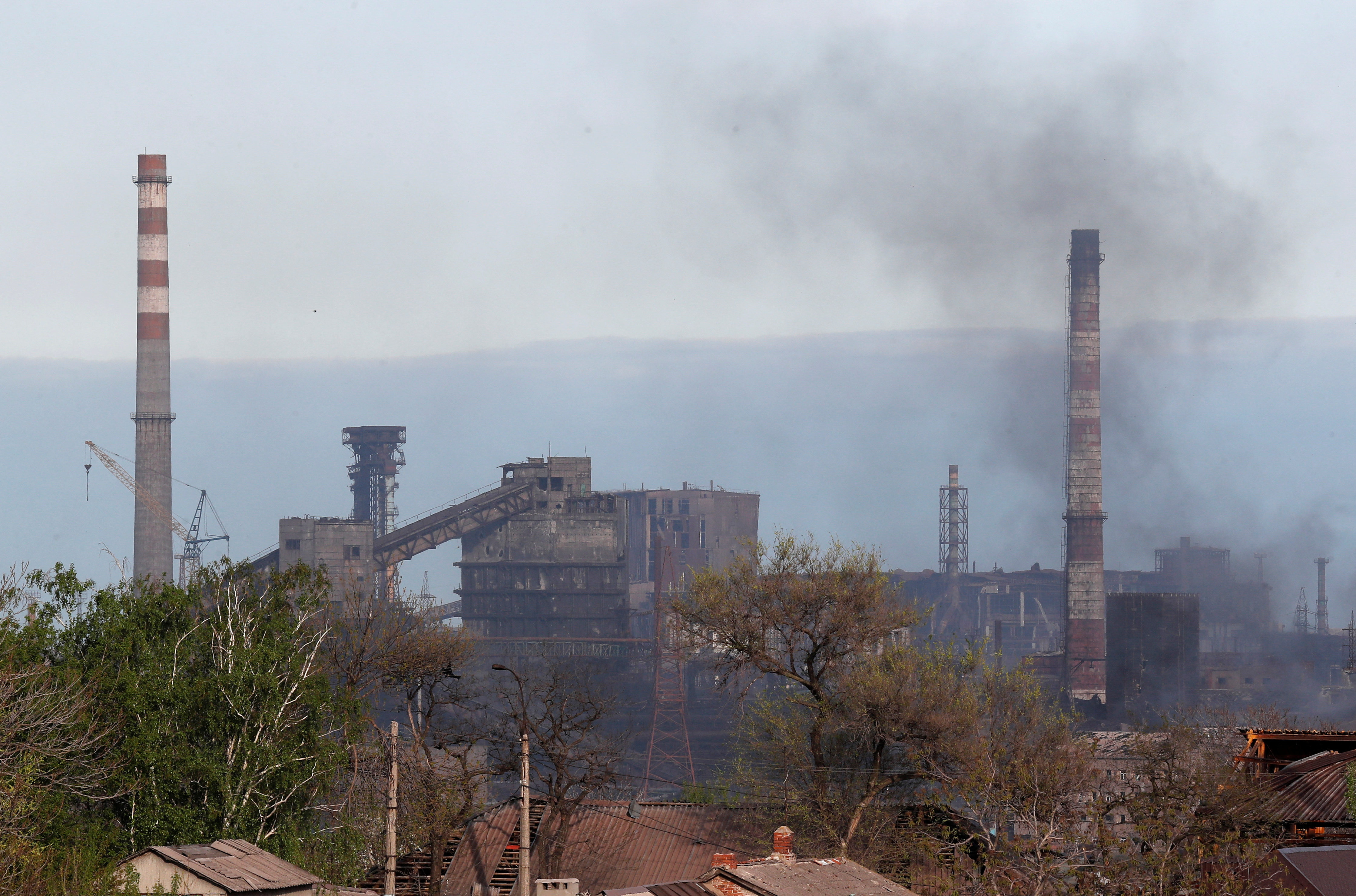 Smoke rises above a plant of Azovstal Iron and Steel Works in Mariupol