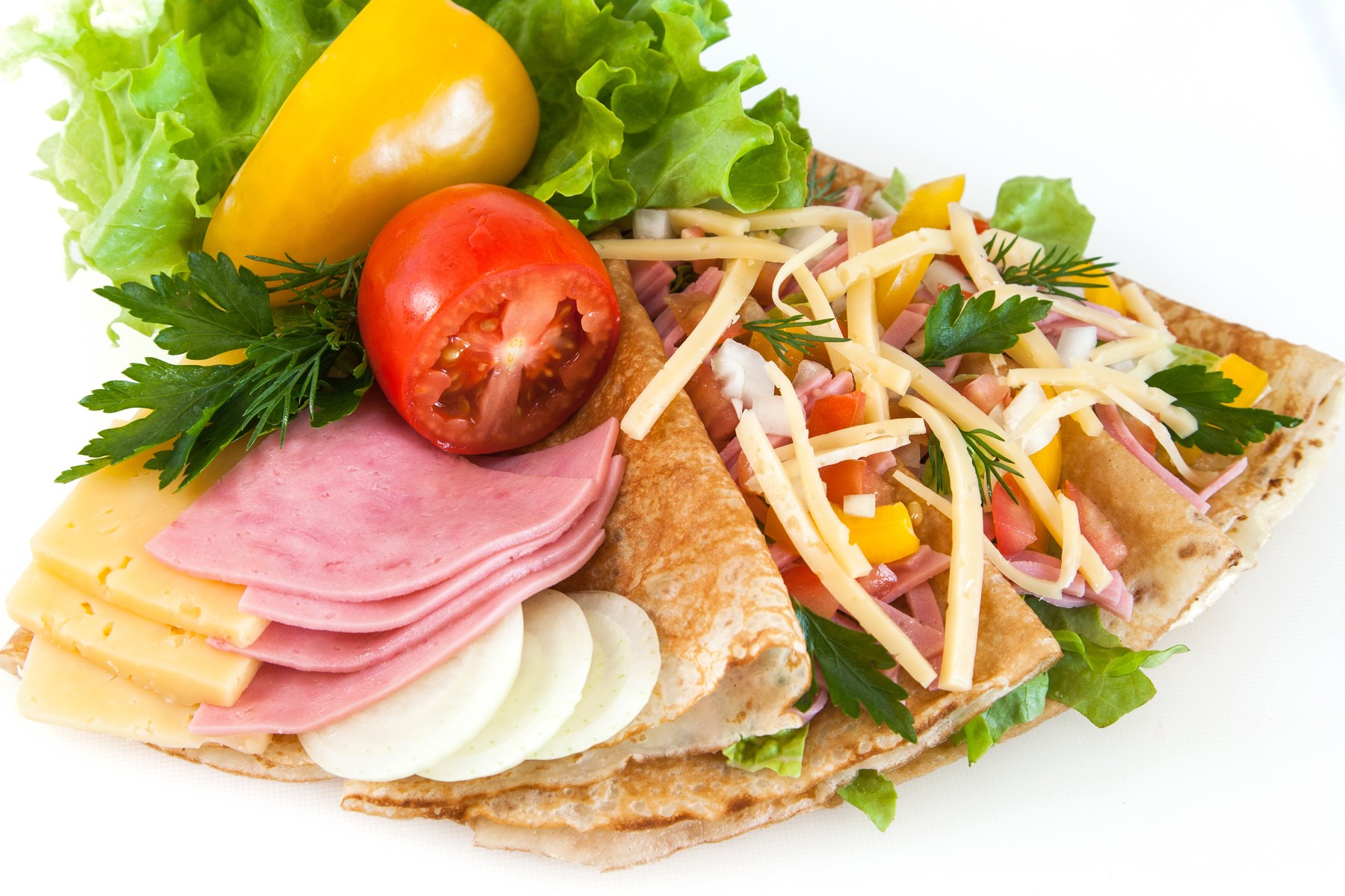 thin pancakes with ham, cheese and vegetables