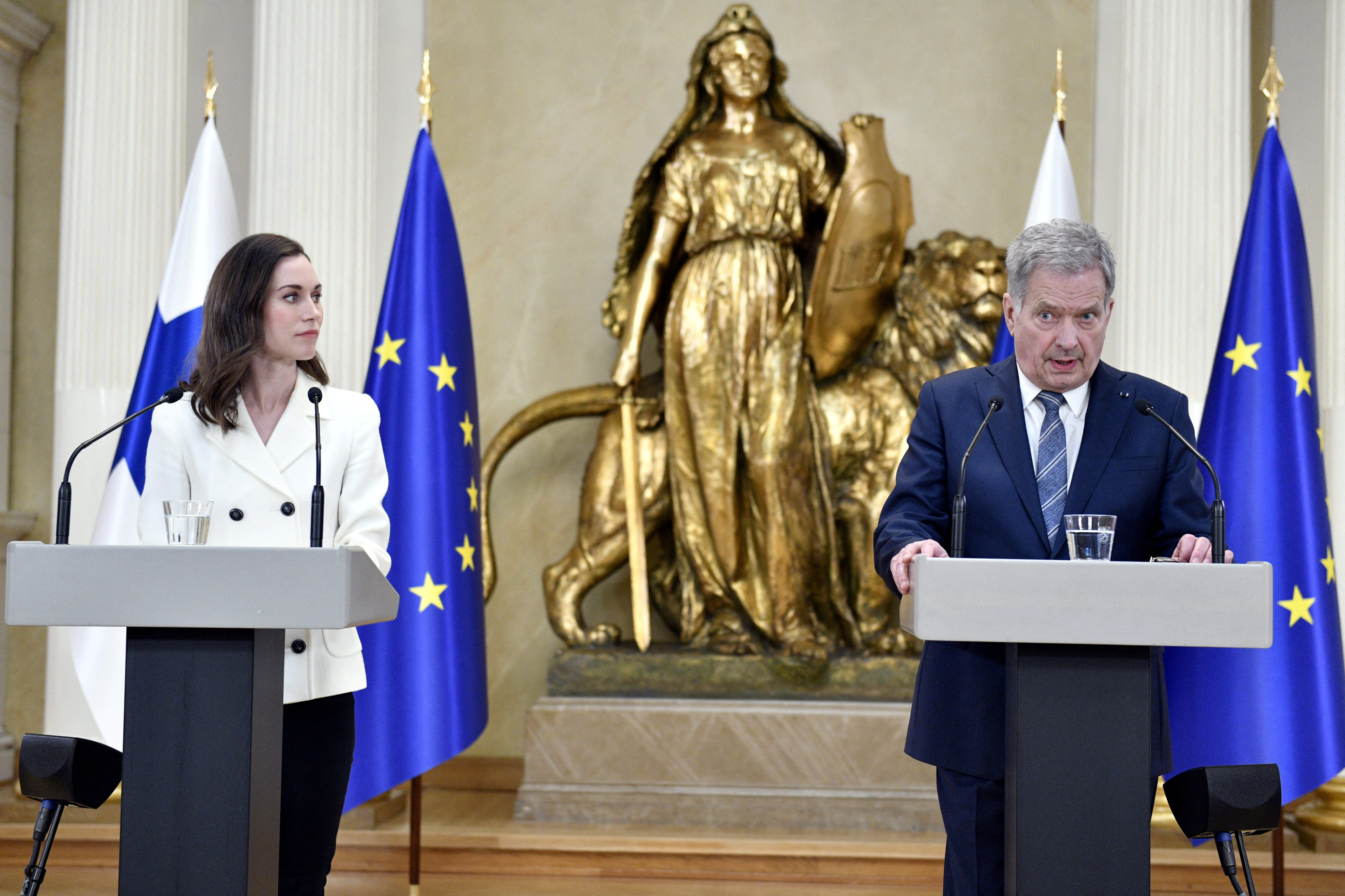 Finland's Prime Minister Sanna Marin and Finland's President Sauli Niinisto attend a joint news conference on Finland's security policy decisions at the Presidential Palace in Helsinki