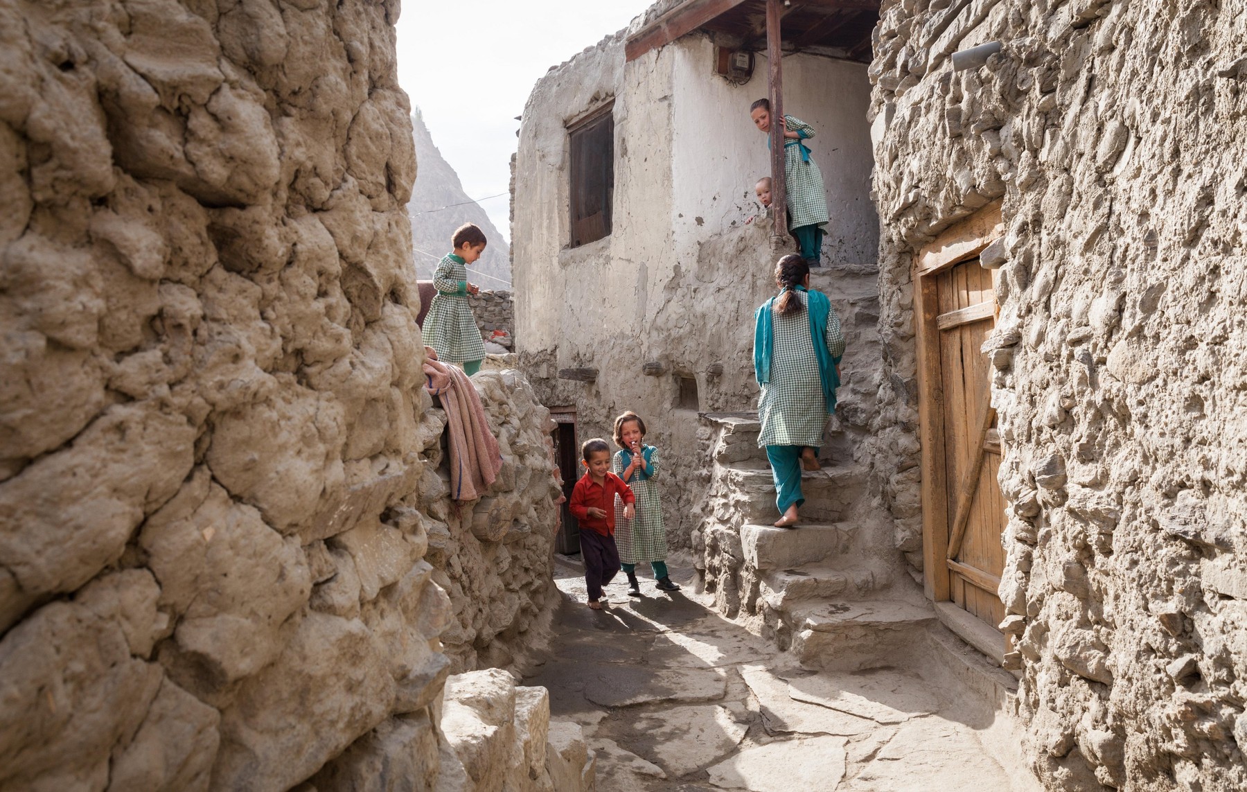 Muslim children in school uniform, living in a traditional village is preparing to go to school