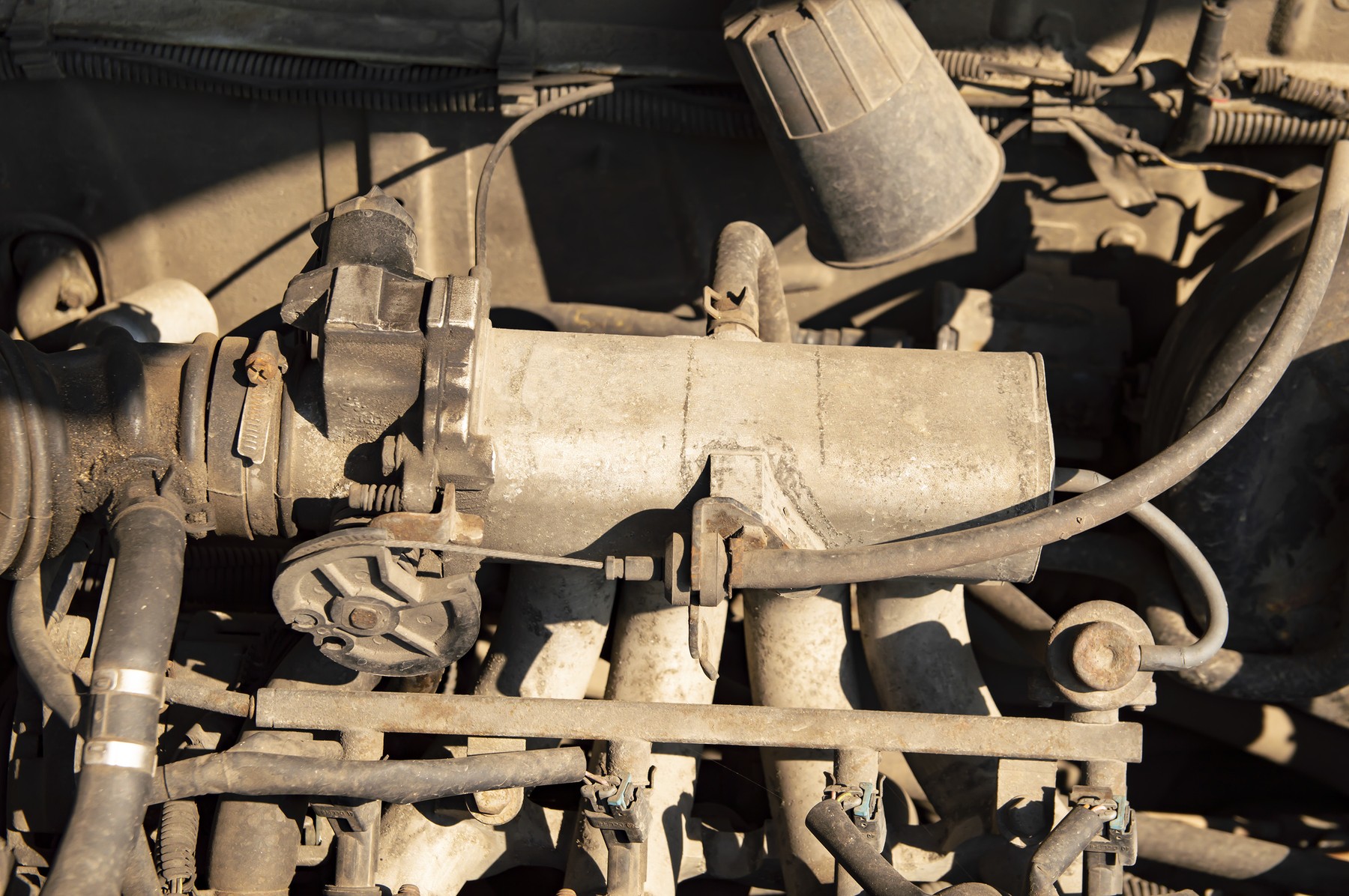 The engine compartment of the car under the hood