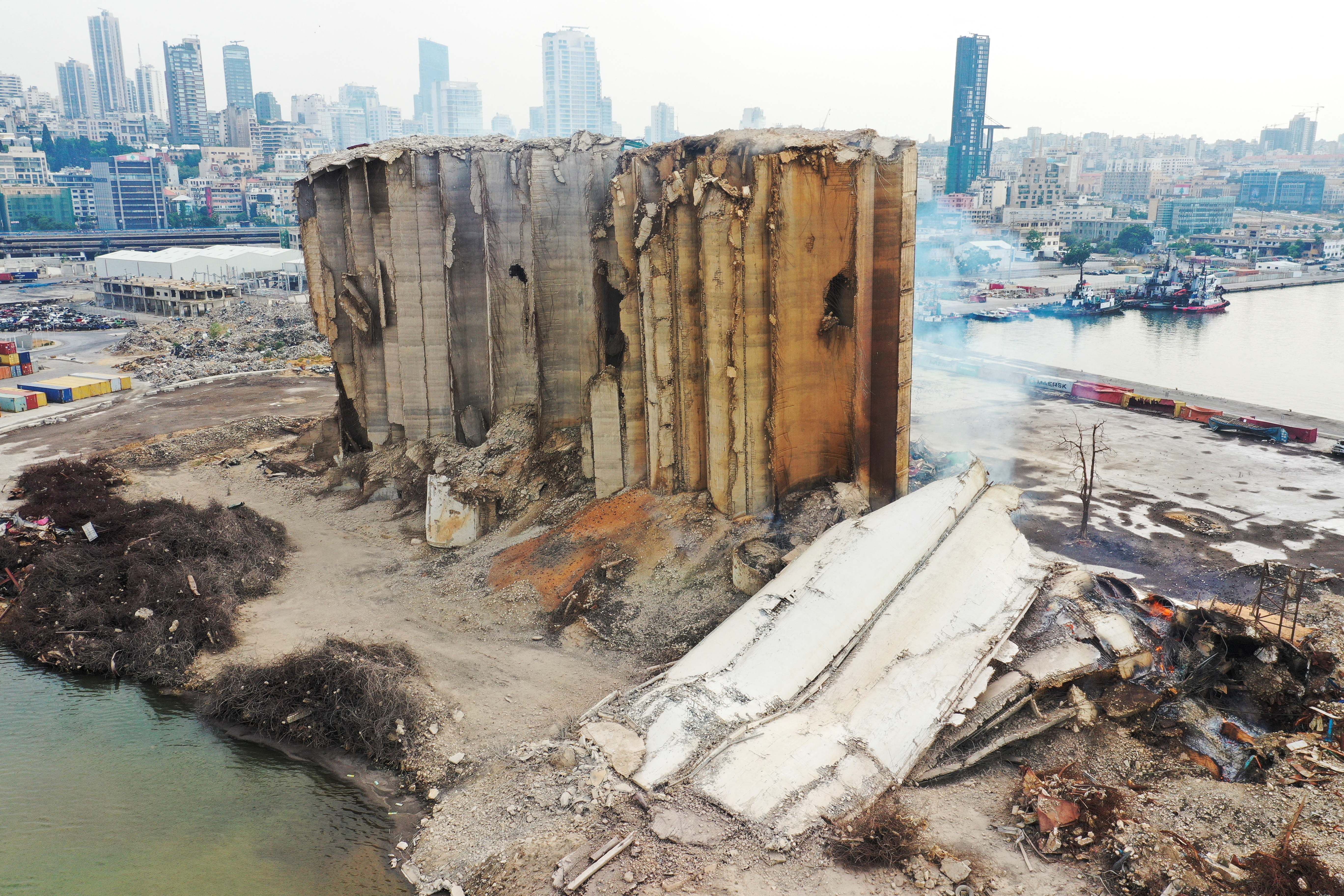 Smoke rises from the newly collapsed part of the Beirut grain silos damaged during August 2020 blast as Lebanon marks the two-year anniversary of the explosion