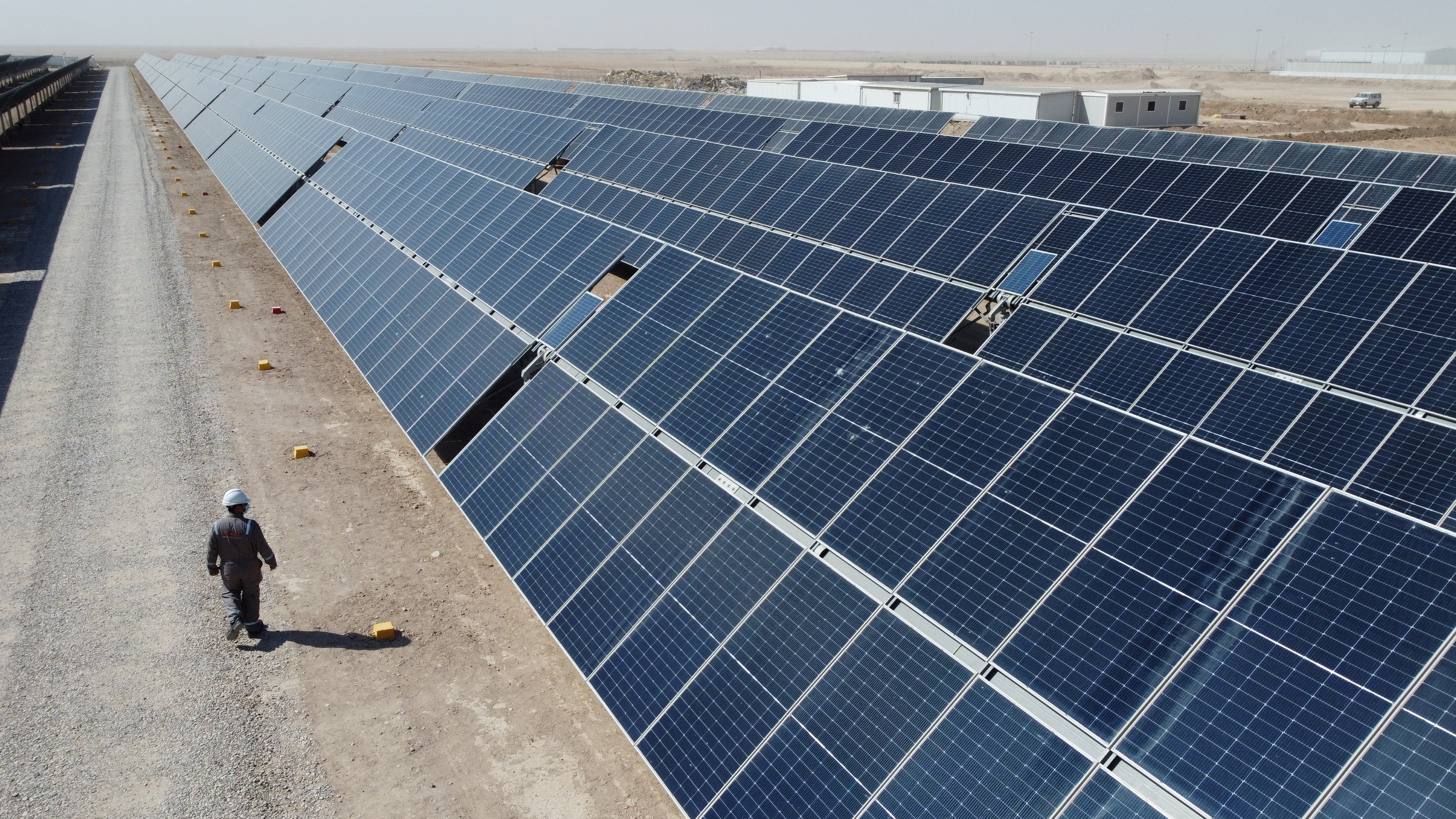 A general view shows solar panels, which are a part of the solar power project at the Faihaa oil field in Basra