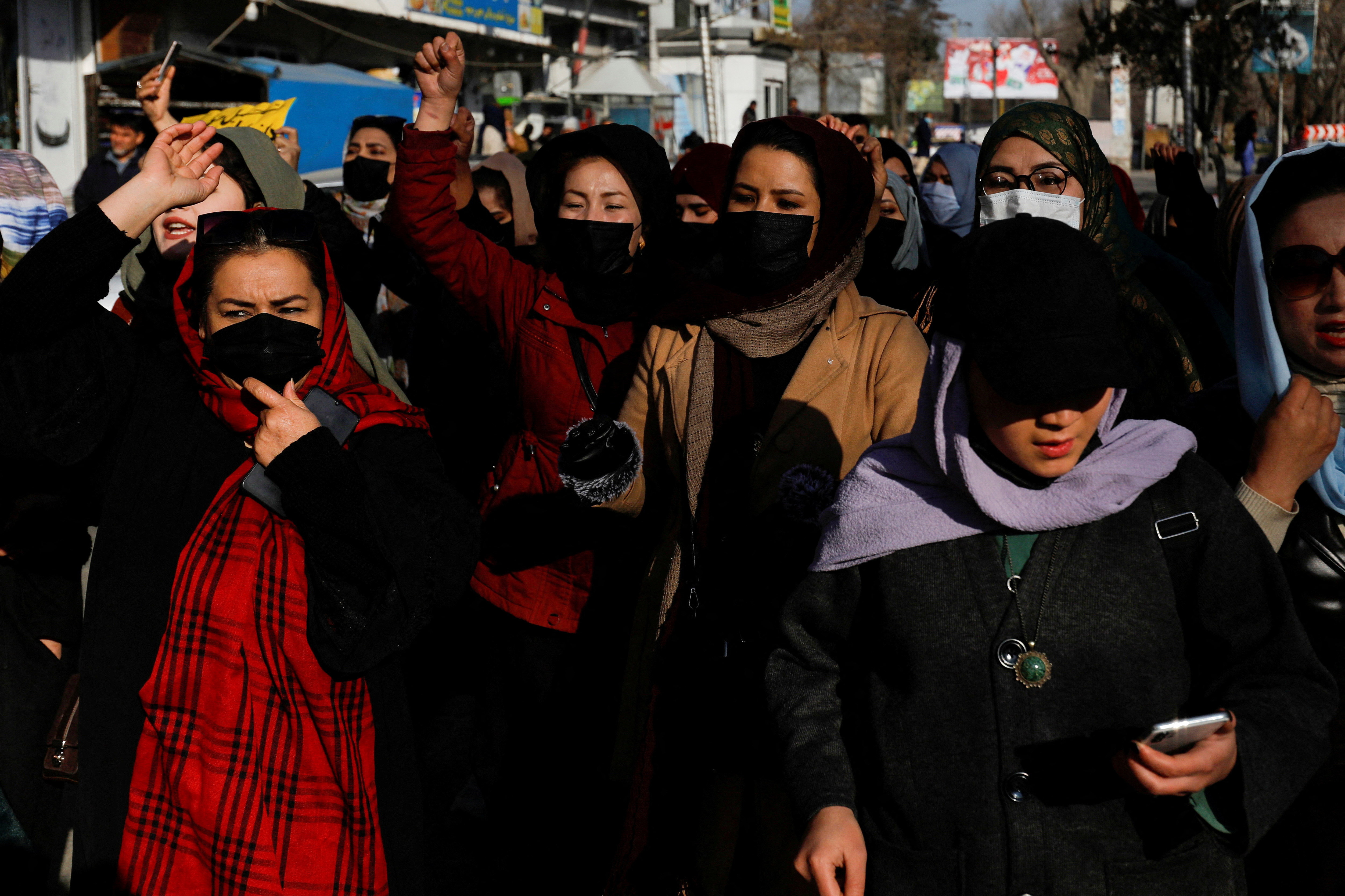 Afghan women chant slogans in protest against the closure of universities to women by the Taliban in Kabul