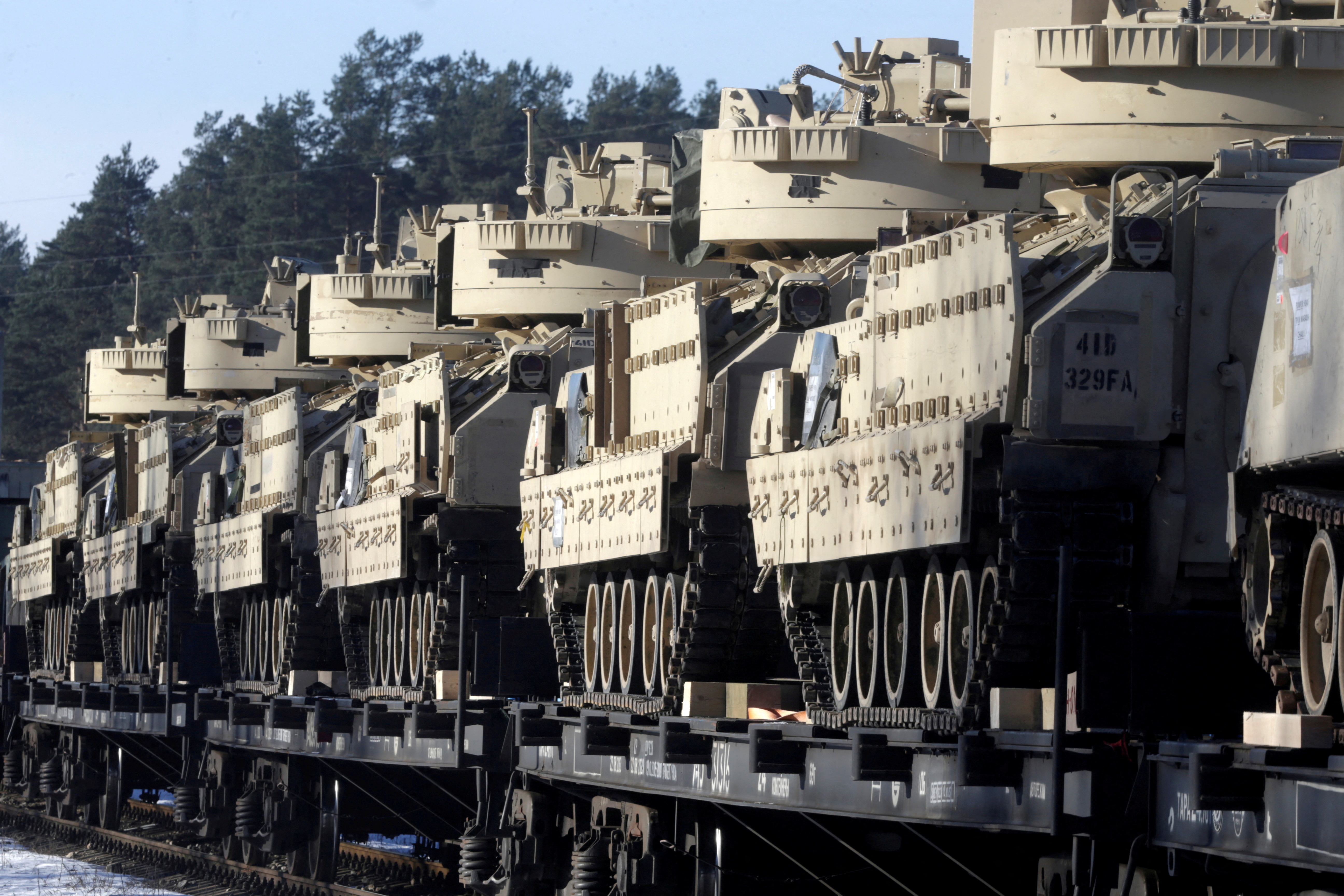 FILE PHOTO: U.S. Bradley Fighting Vehicles that will be deployed in Latvia for NATO's Operation Atlantic Resolve wait for an unload in Garkalne