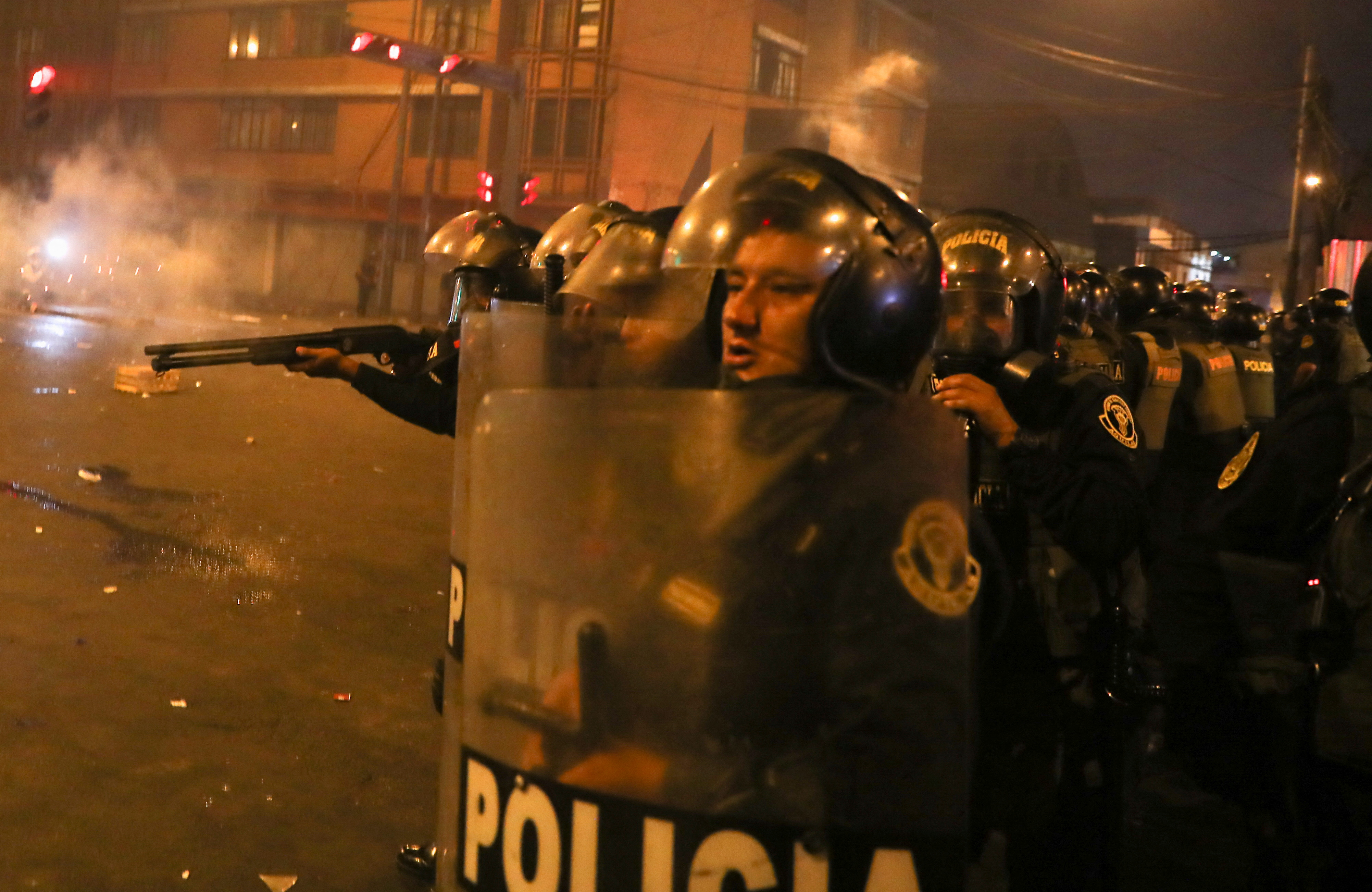 Anti-government protesters take part in a march in Lima