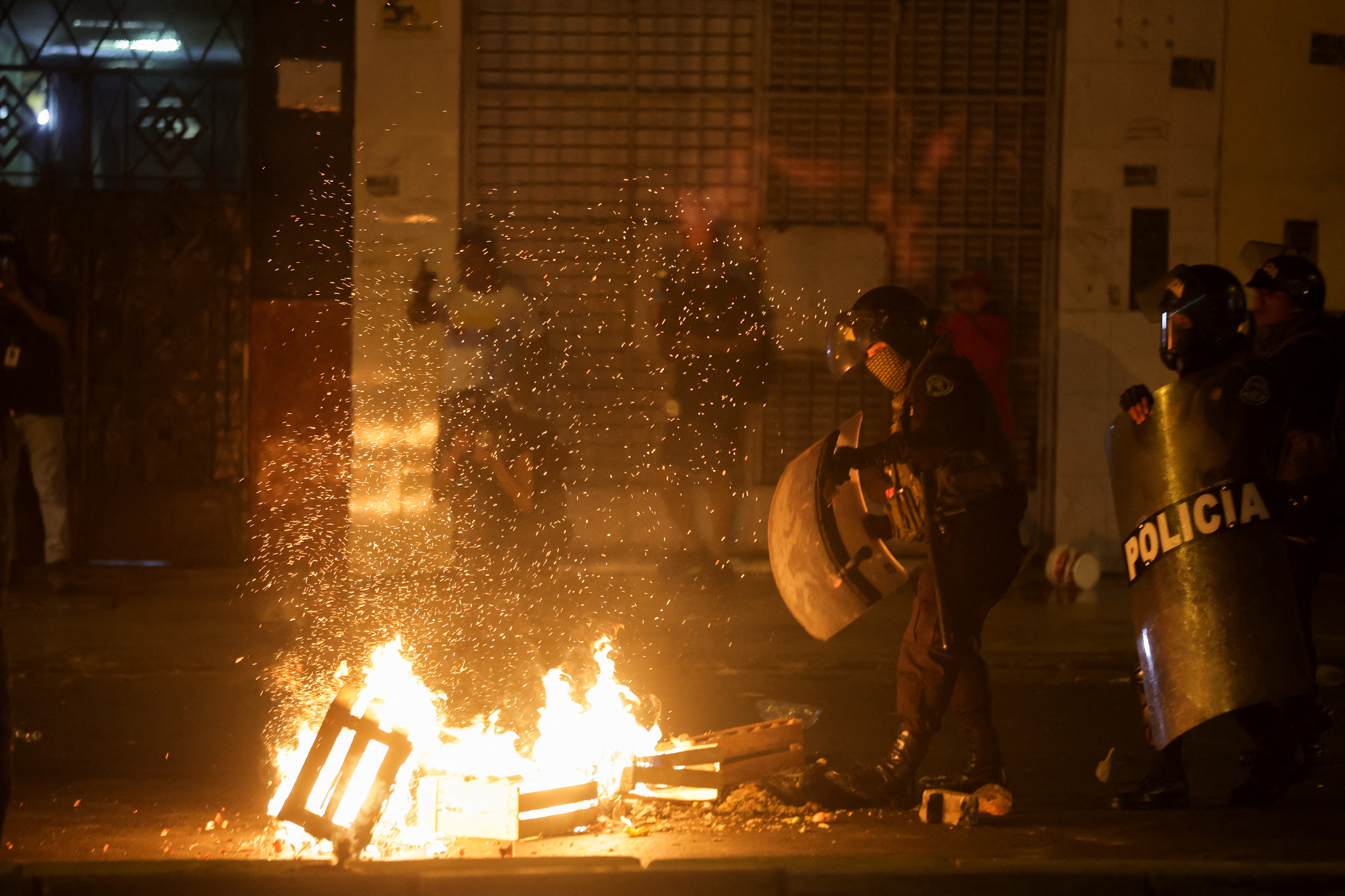 Anti-government protesters take part in a march in Lima