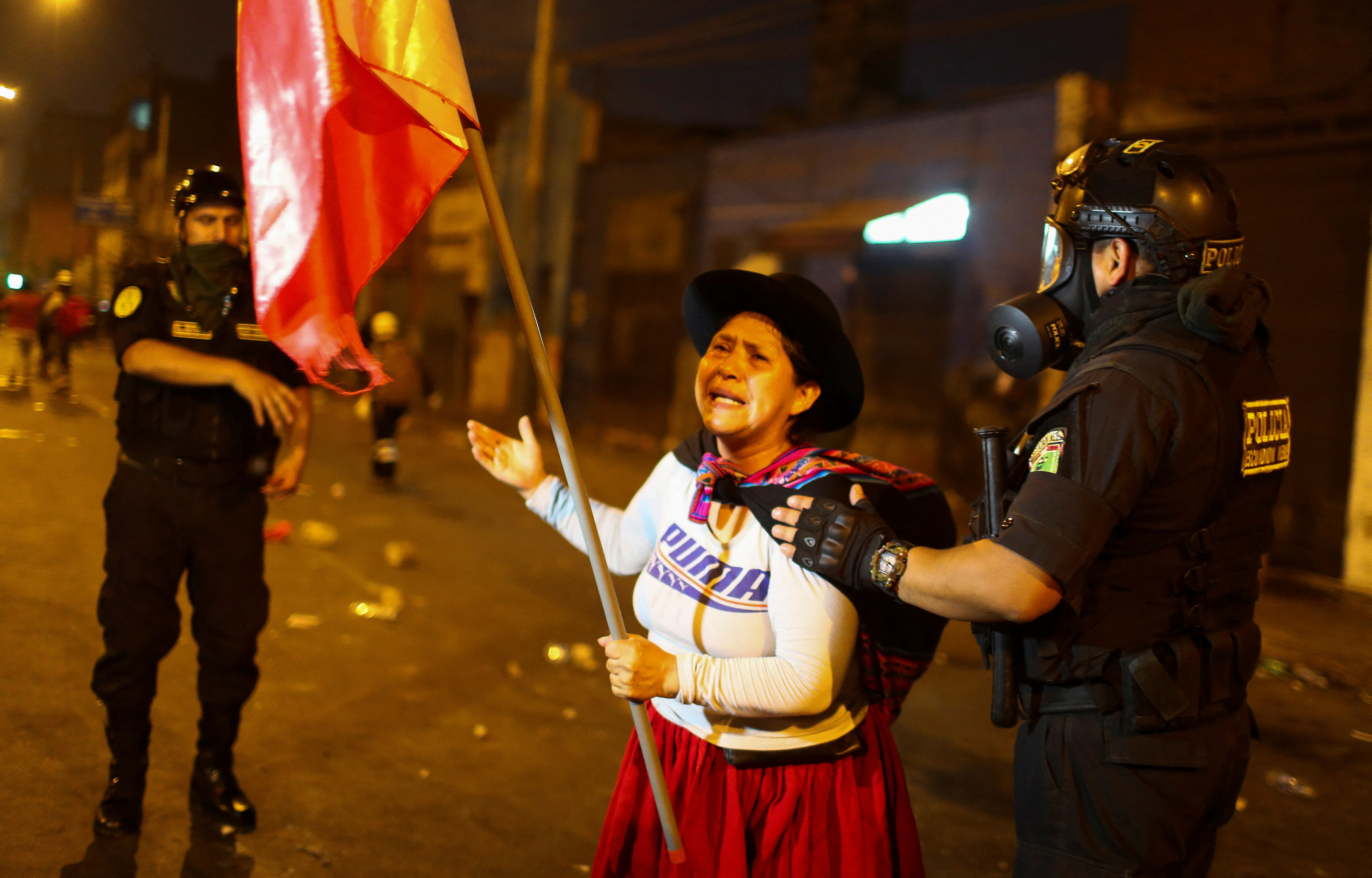 Anti-government protesters take part in a march in Lima