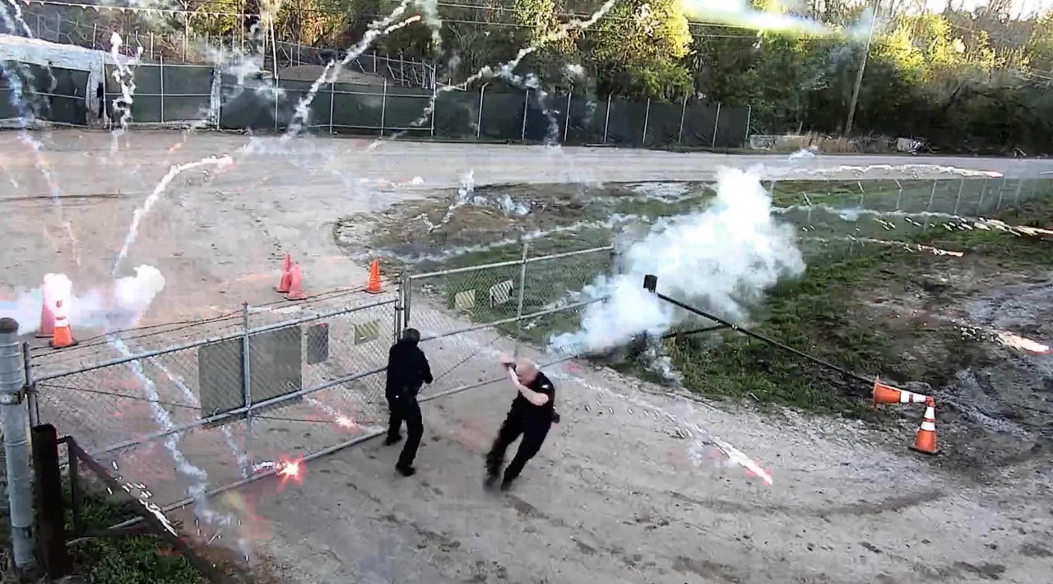 Protesters and police members clash at the construction site of an Atlanta police training center