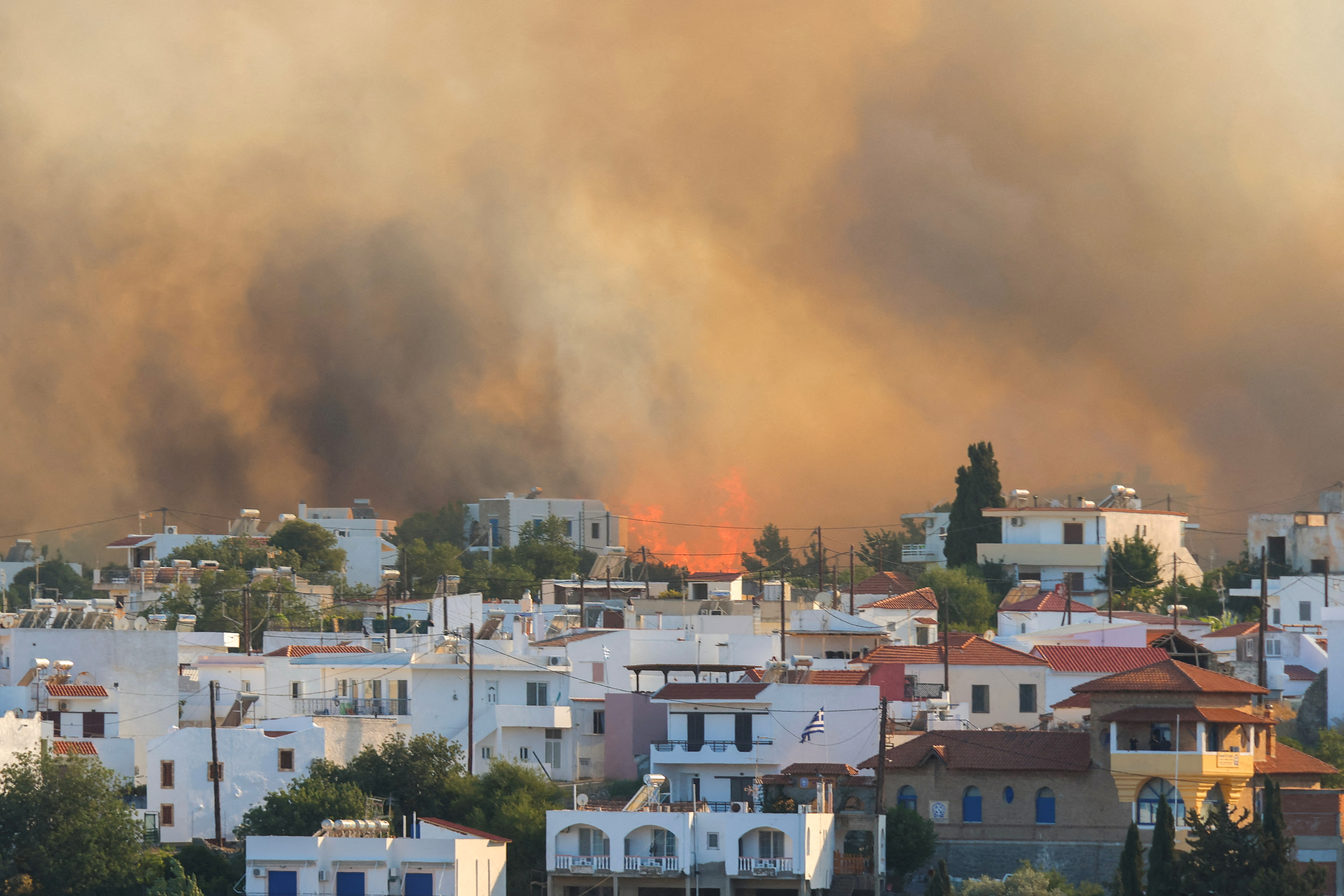FILE PHOTO: Wildfire burns on the island of Rhodes