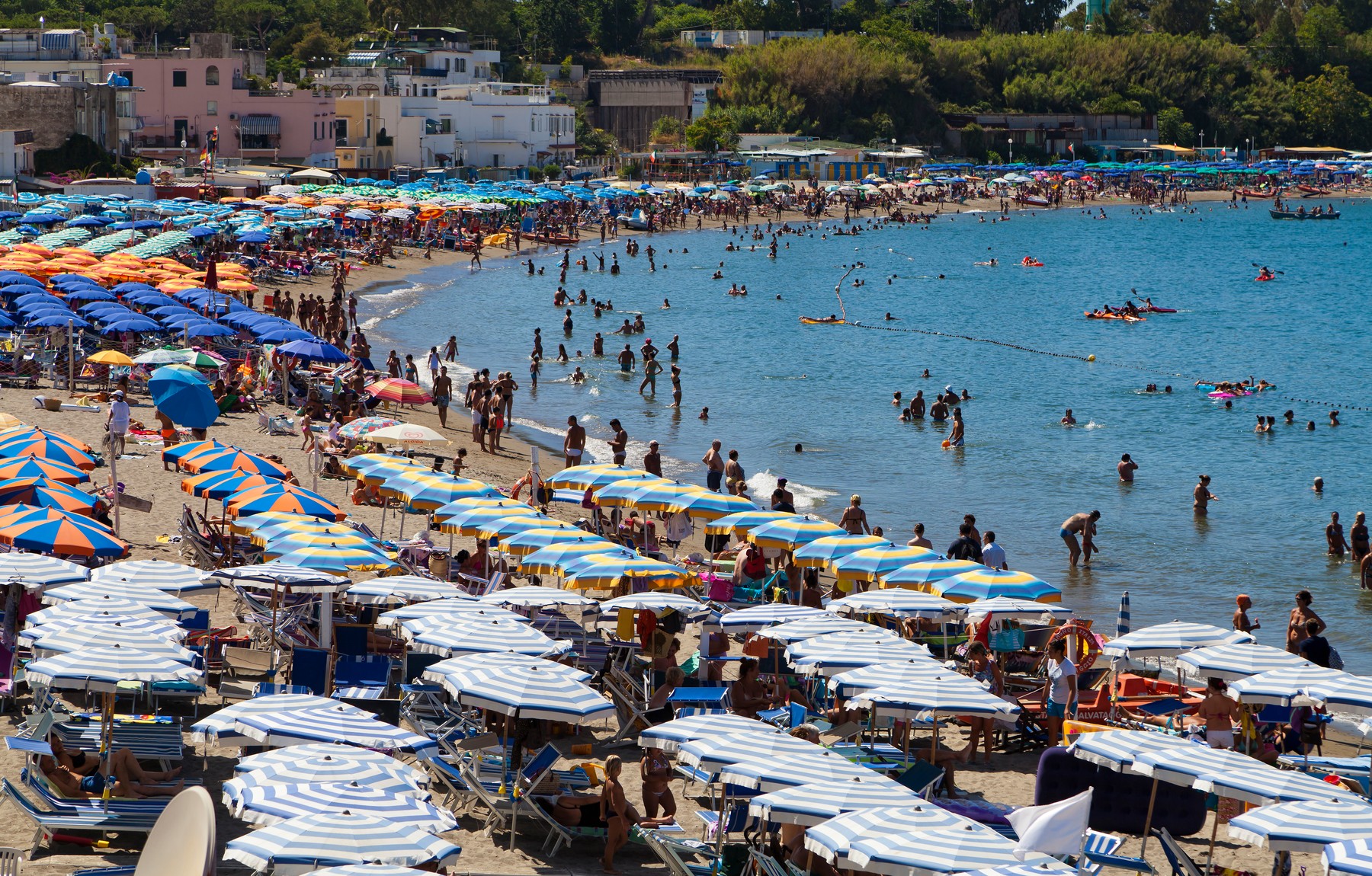 Ischia island,beach,castle,travel,summer,holiday,crazy,sun,sand,sea,water,people,tourism,tourists,italian,Campania,Italy,horizontal,umbrellas