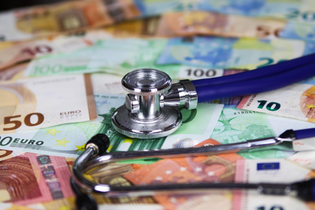 Medical cost concept - Stethoscope on euro paper money bank notes