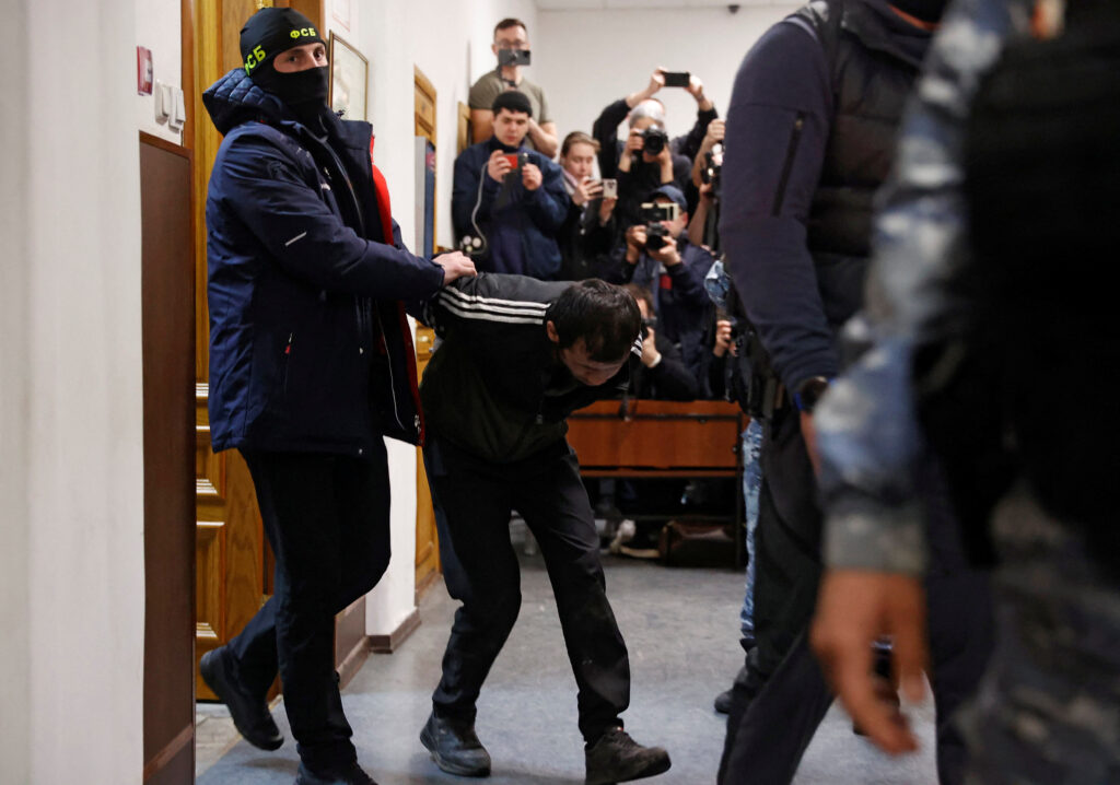 1711316166-2024-03-24T213257Z_588338467_RC2LS6A65WC5_RTRMADP_3_RUSSIA-SHOOTING-SUSPECTS-COURT-1024x718.jpg