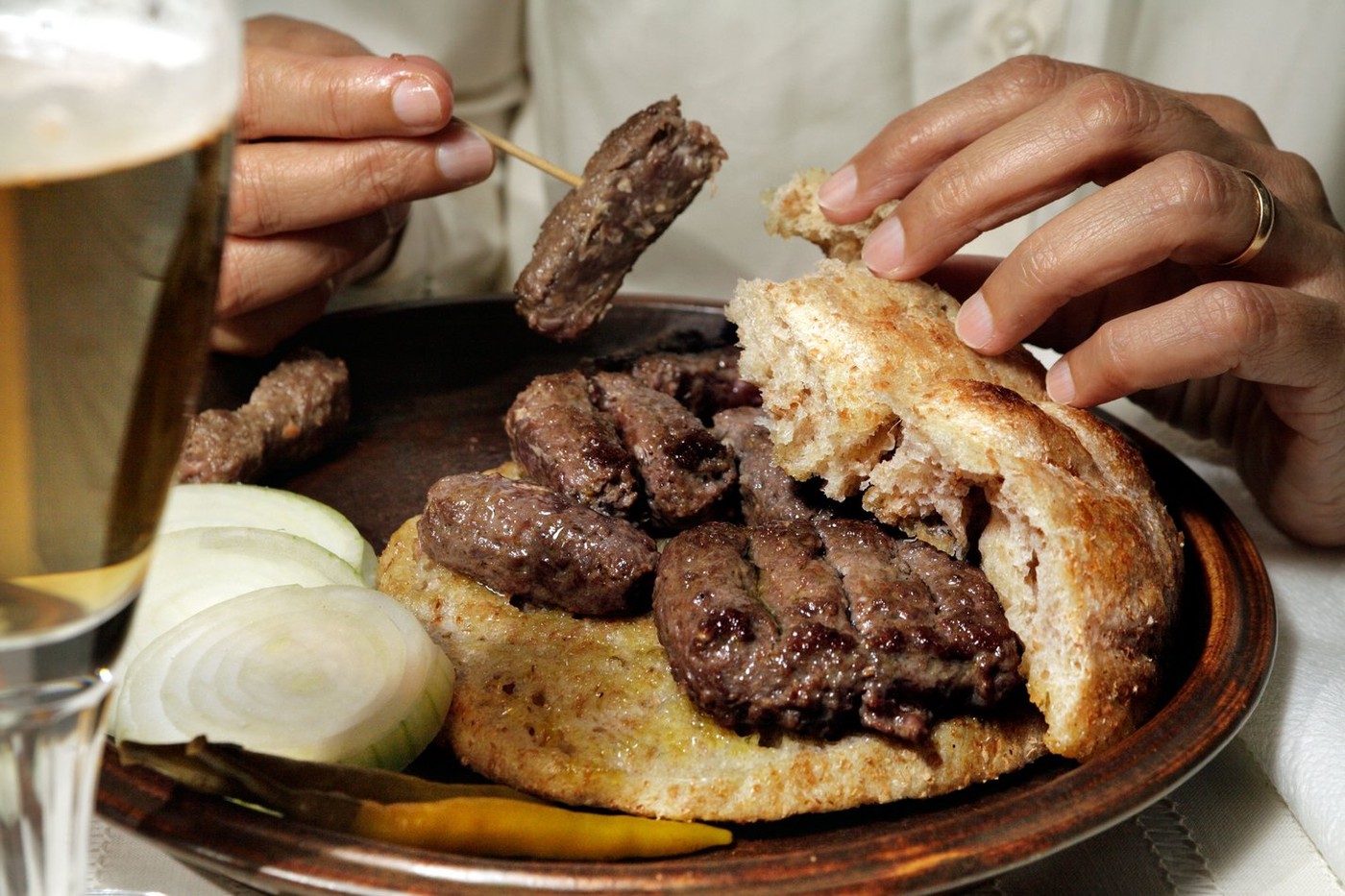 Cevapcici  or Cevapi traditionally eaten with a toothpick only - Fast Food of Balkans