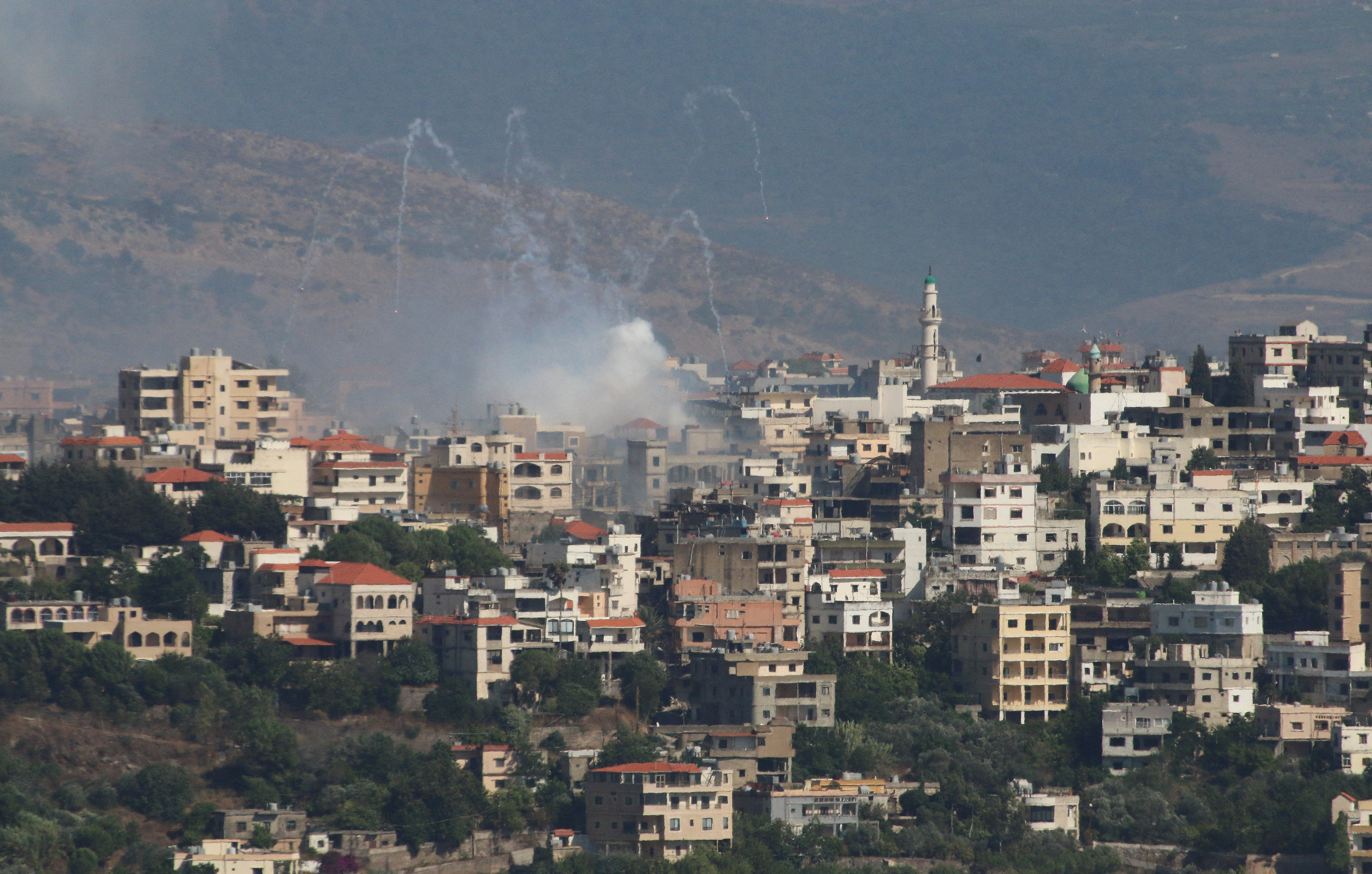 FILE PHOTO: Smoke rises from the village of Khiam, amid cross-border hostilities between Hezbollah and Israeli forces, as pictured from Marjayoun, near the border with Israel
