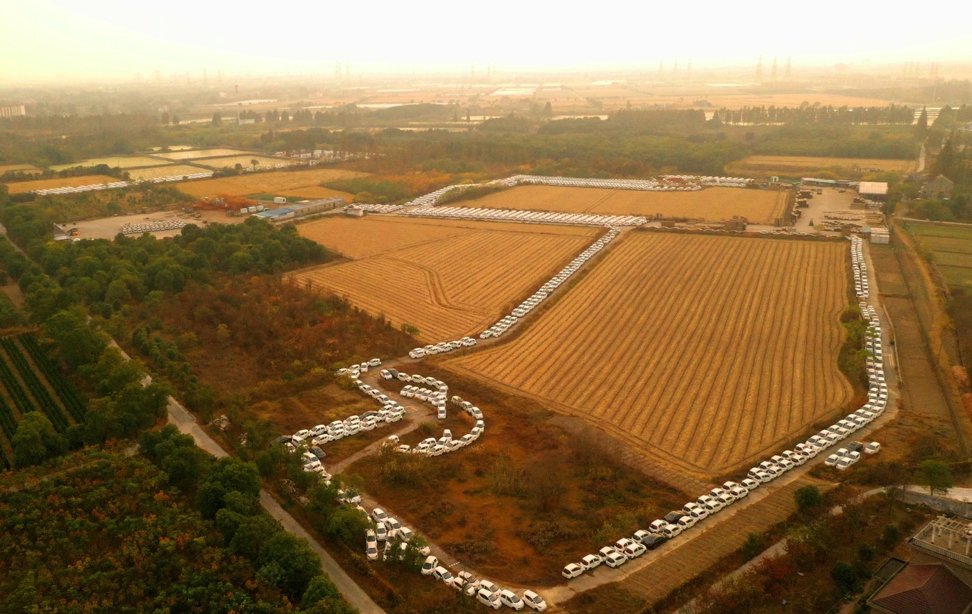 Abandoned Electric Sharing Cars JIAXING, CHINA - NOVEMBER 23, 2019 - (FILE) Abandoned electric sharing cars sit in a par