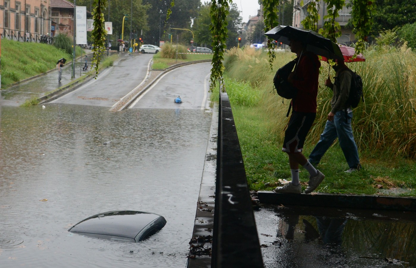 Italy, Milan: Flooding hits Milan. Car completely submerged in the underpass of Via Pompeo Leoni - the woman on board the car was rescued