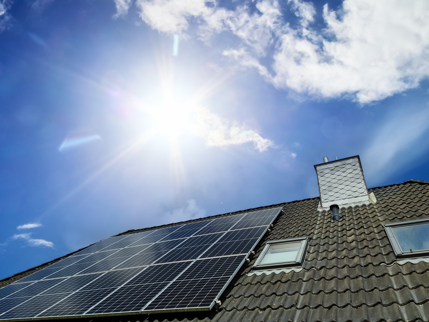Solar panels producing clean energy on a roof of a residential h
