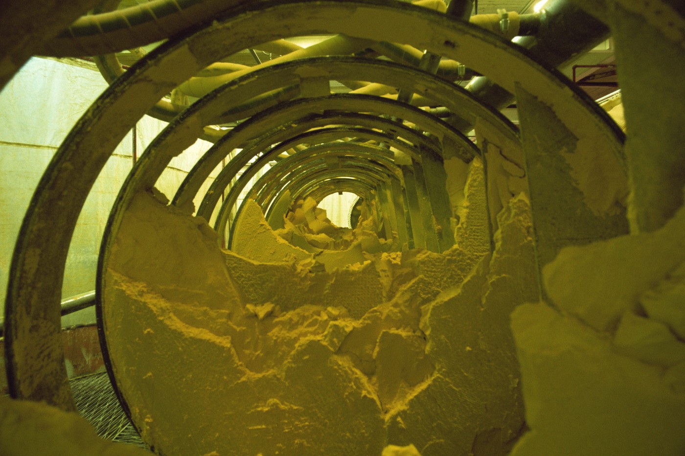 Yellow cake, powdery uranium oxide in Burwell filter press, Uranium City, Saskatchewan, Canada, North America