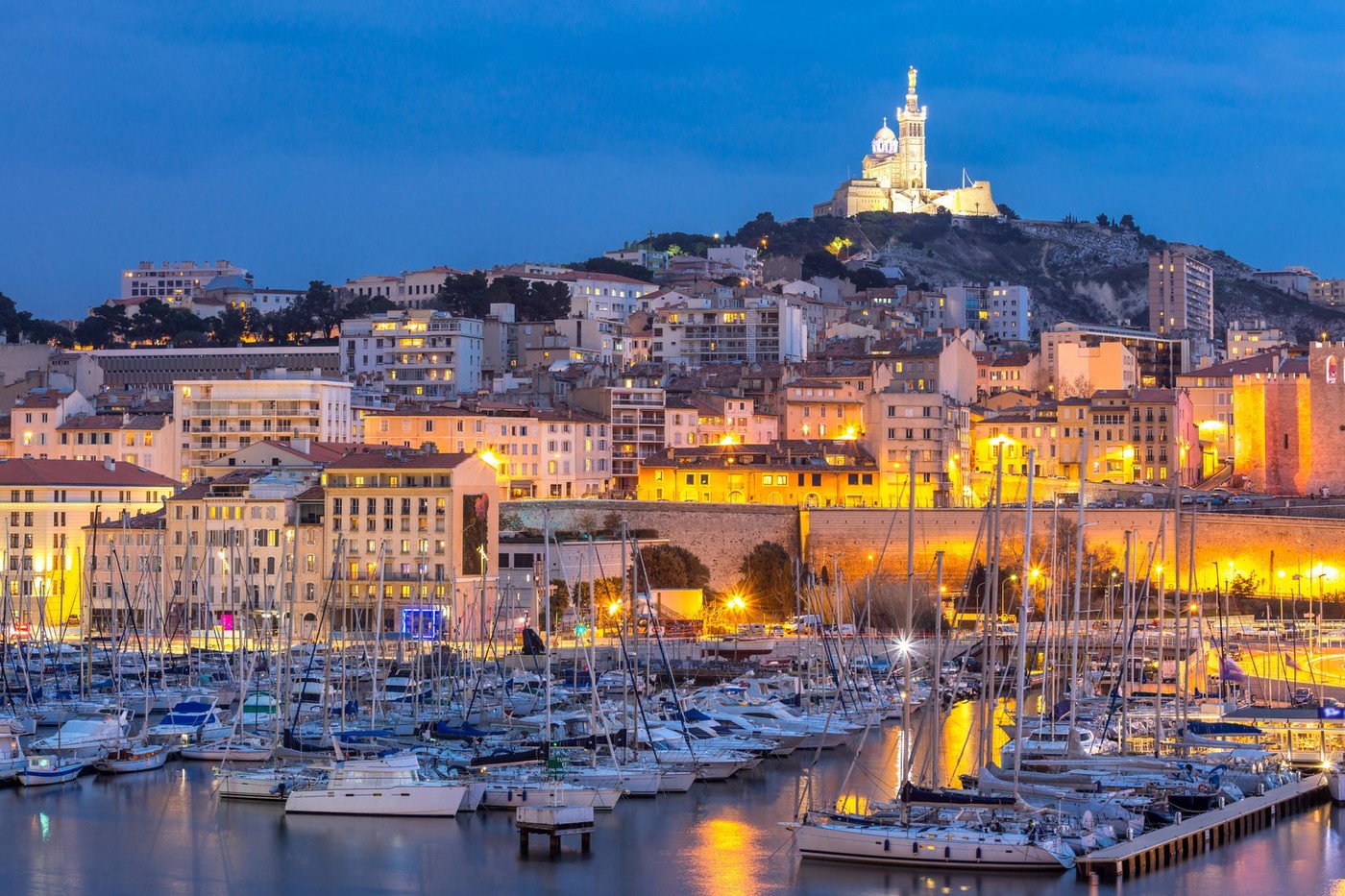 Marseille, France at night. The famous european harbour view on the Notre Dame de la Garde