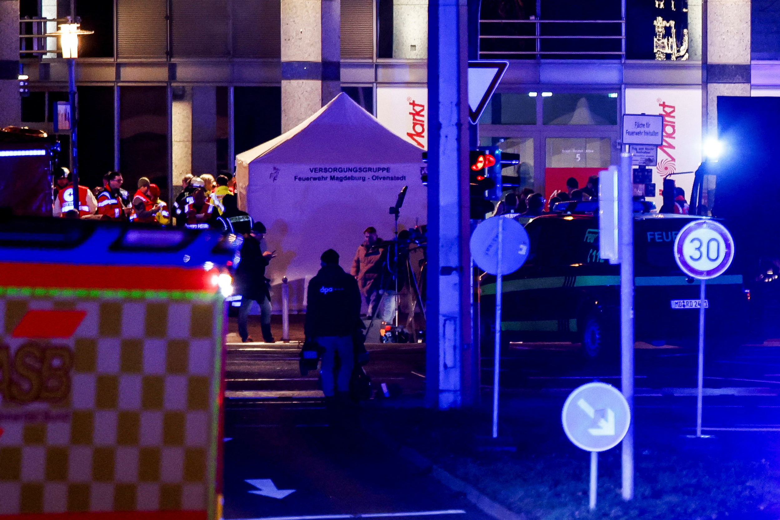 Emergency personnel work at a Christmas market after a car drove into a group of people, in Magdeburg