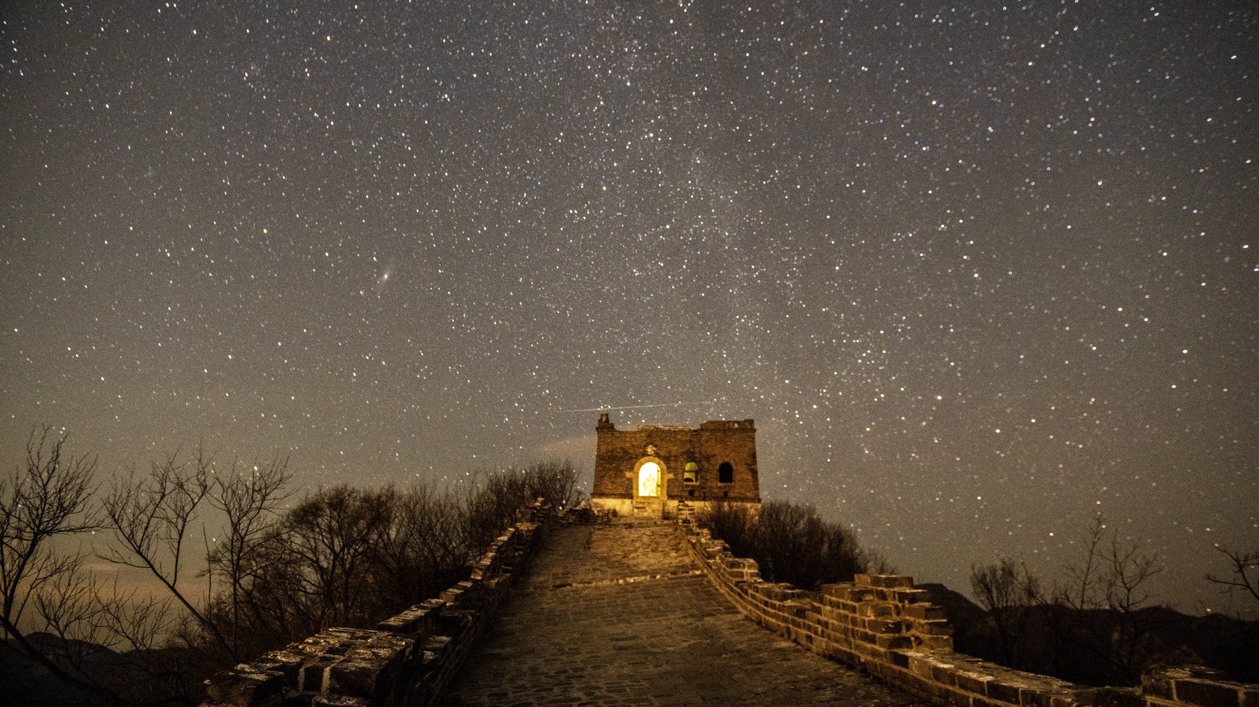 BEIJING, CHINA - JANUARY 04: Quadrantid meteor shower is observed in the night sky over the Great Wall on January 4, 202