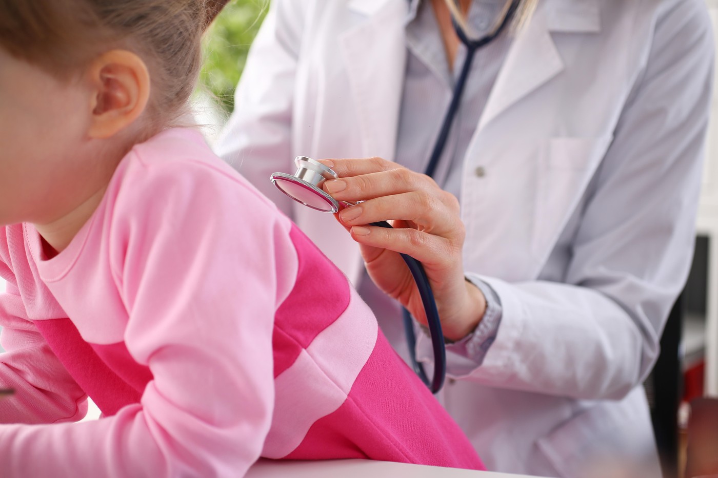 Little child with stethoscope at doctor reception