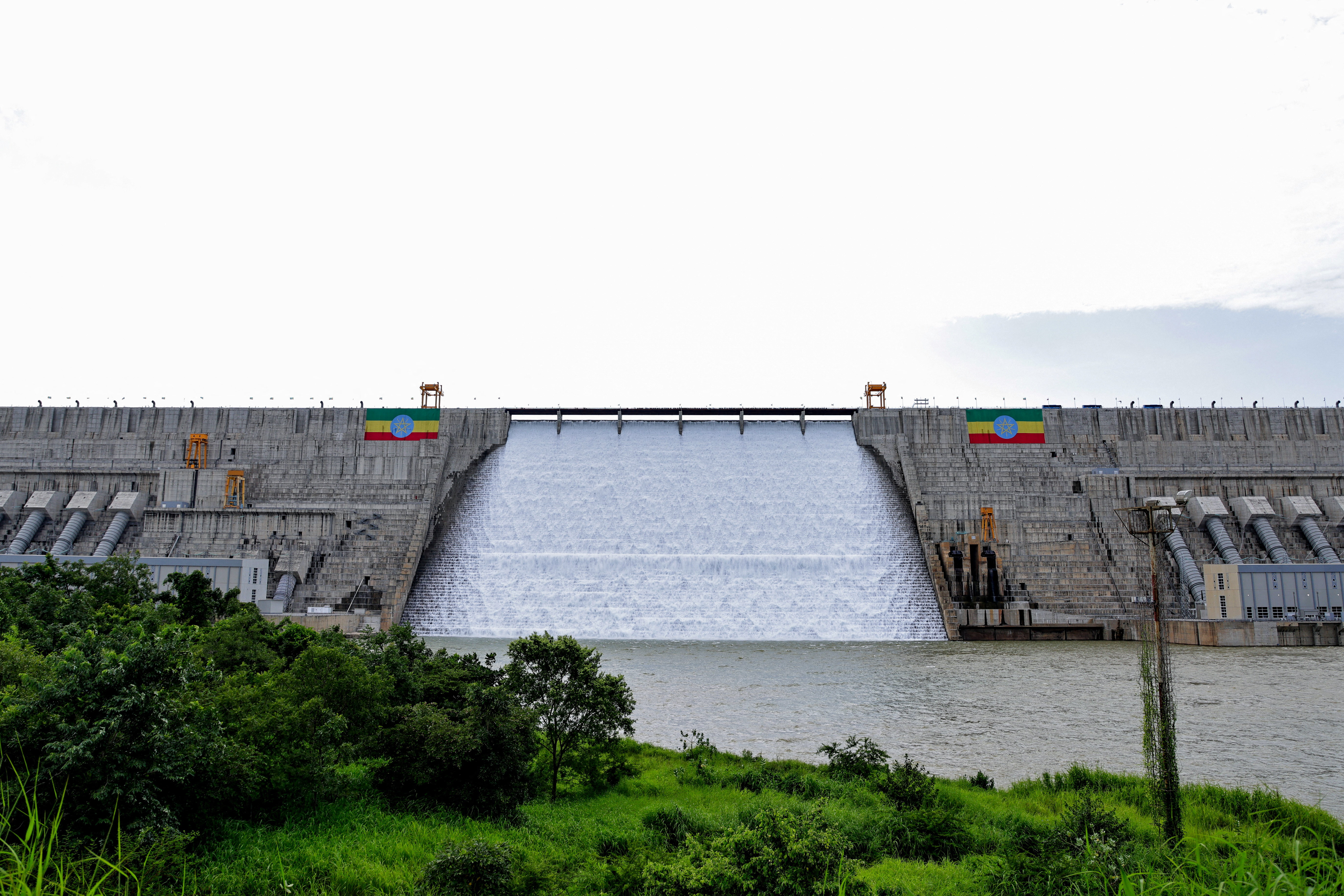 Large Ethiopian flags are displayed on the Grand Ethiopian Renaissance Dam (GERD), built along the Blue Nile, during its inauguration, in Guba, Benishangul-Gumuz region, Ethiopia, September 9, 2025. REUTERS/ Tiksa Negeri