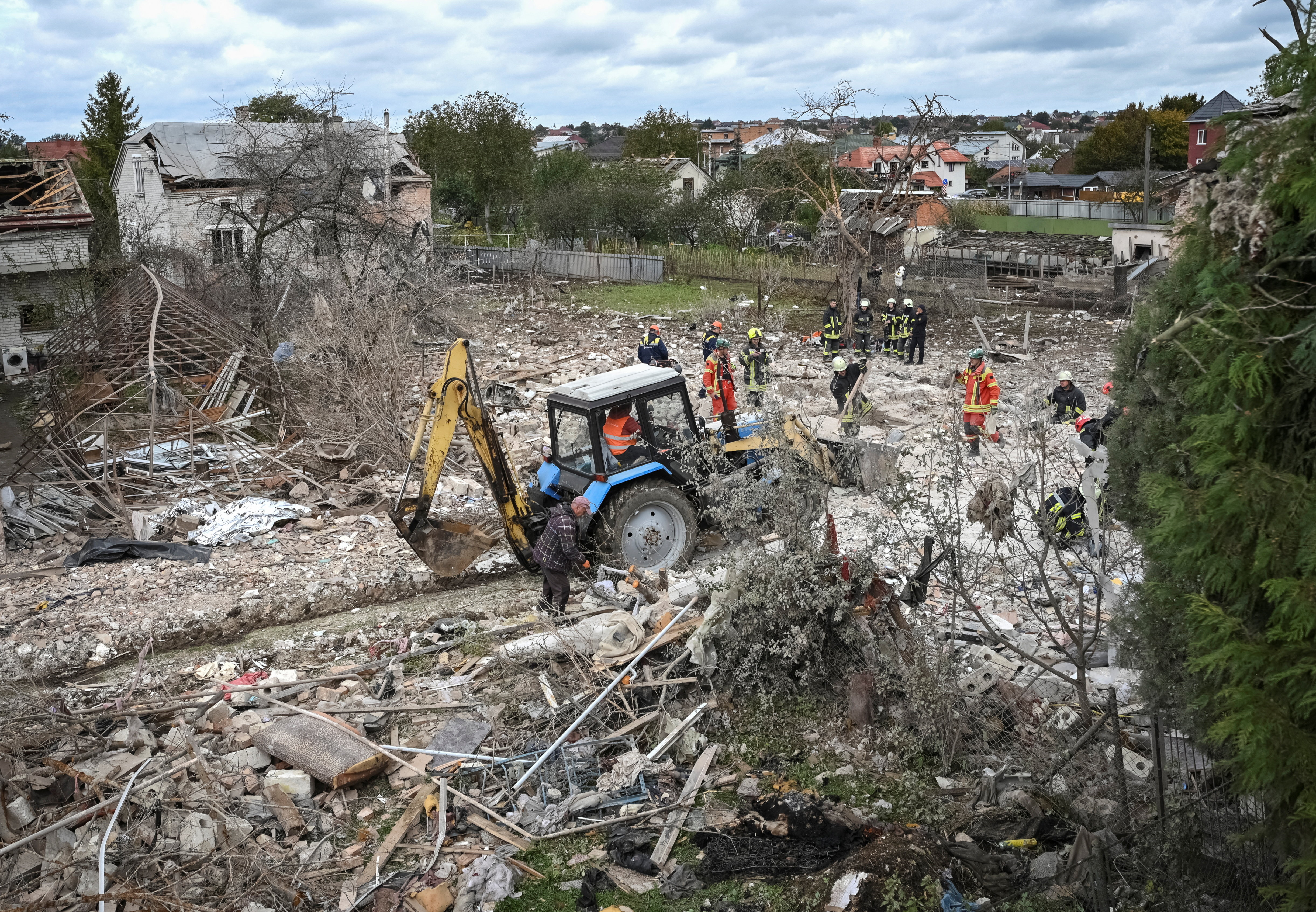 Rescuers work at the site of a house destroyed during a Russian drone and missile strike, amid Russia's attack on Ukraine, in the village of Lapaivka on the outskirts of Lviv, Ukraine October 5, 2025. REUTERS/Stringer