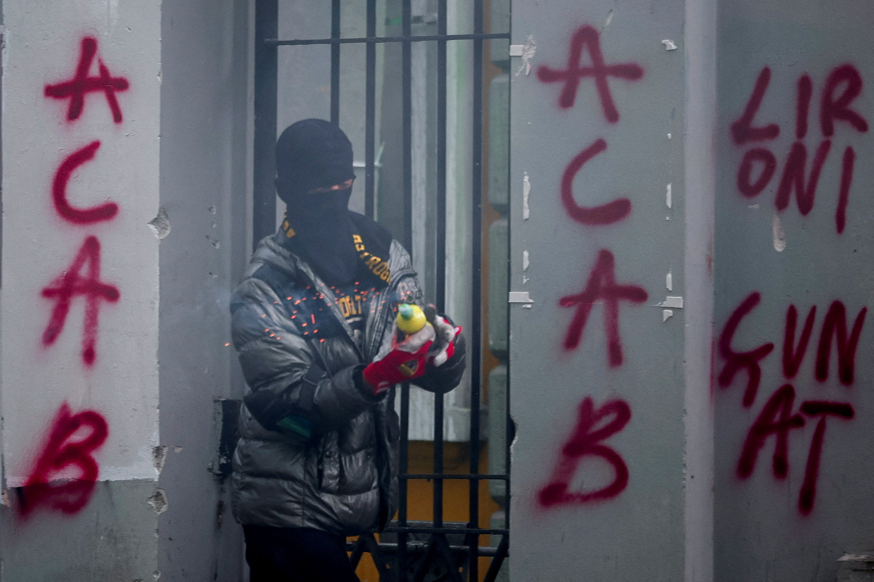 A protester prepares to throw a pyrotechnic device attached to a petrol bomb during an anti-government protest in Tirana, Albania, October 31, 2026. REUTERS/Florion Goga