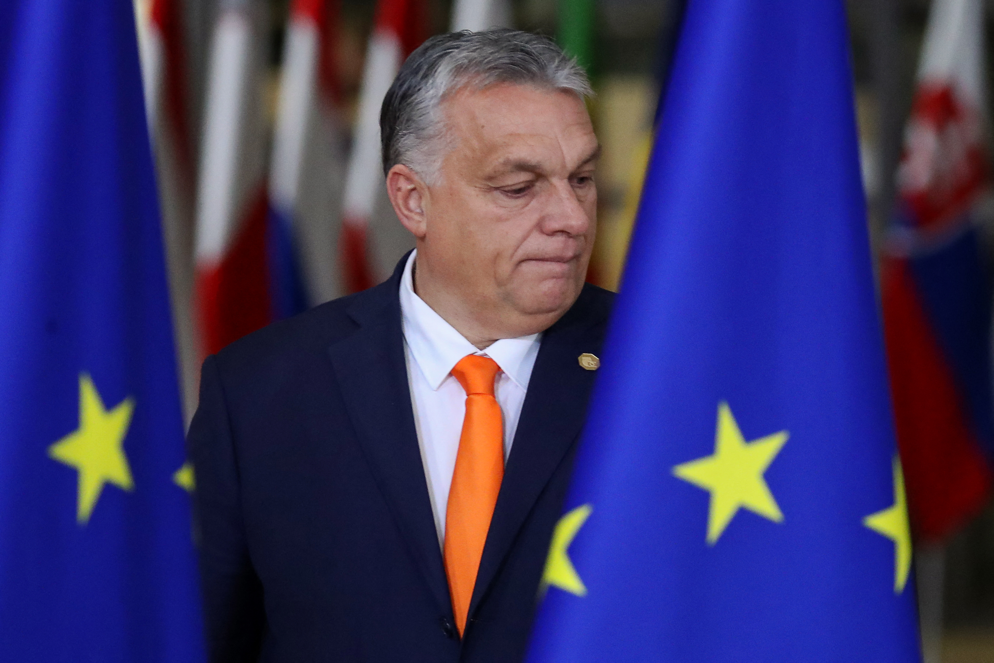 Hungary's Prime Minister Viktor Orban prepares for a family picture during the