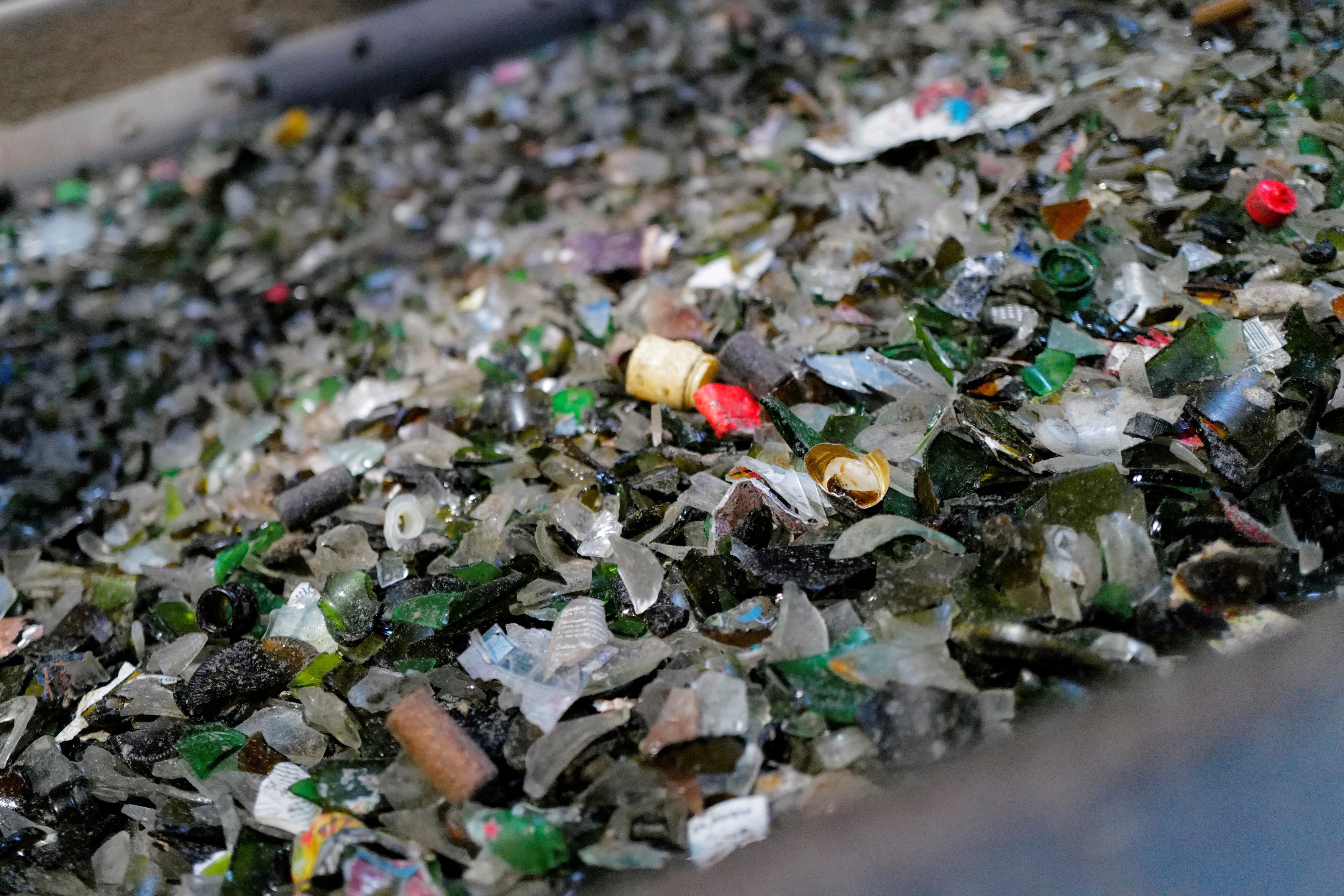 This photograph shows pieces of glass on a conveyor at the Maltha glass processing center in Beziers, southern France, on November 19, 2024.,Image: 937102905, License: Rights-managed, Restrictions: , Model Release: no