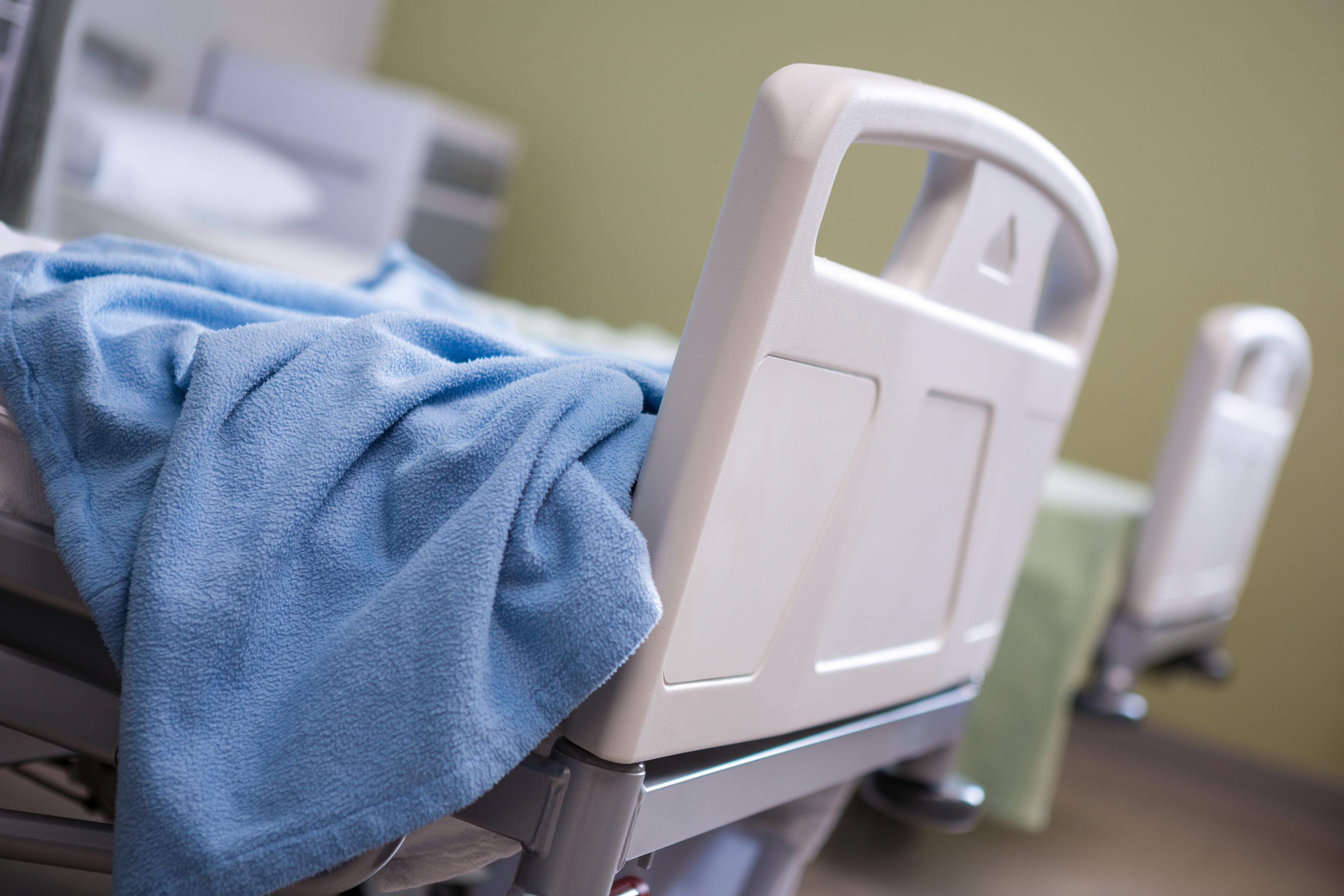 Close-up of empty beds in ward at hospital,Image: 326891335, License: Rights-managed, Restrictions: , Model Release: yes