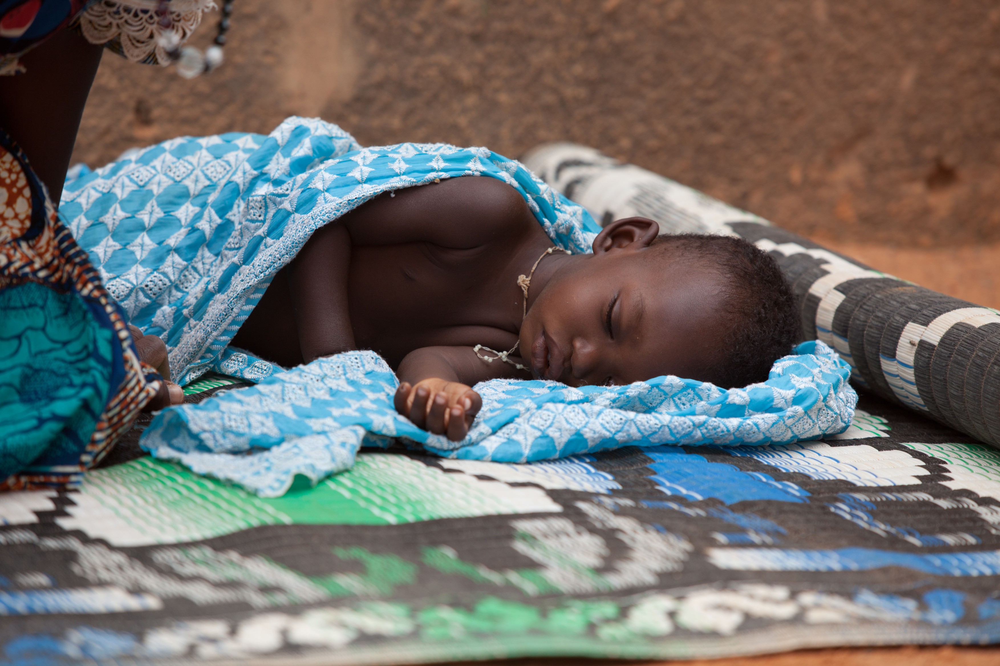 In the town of Djibo in northern Burkina Faso, a Fulani child is sick with malaria.