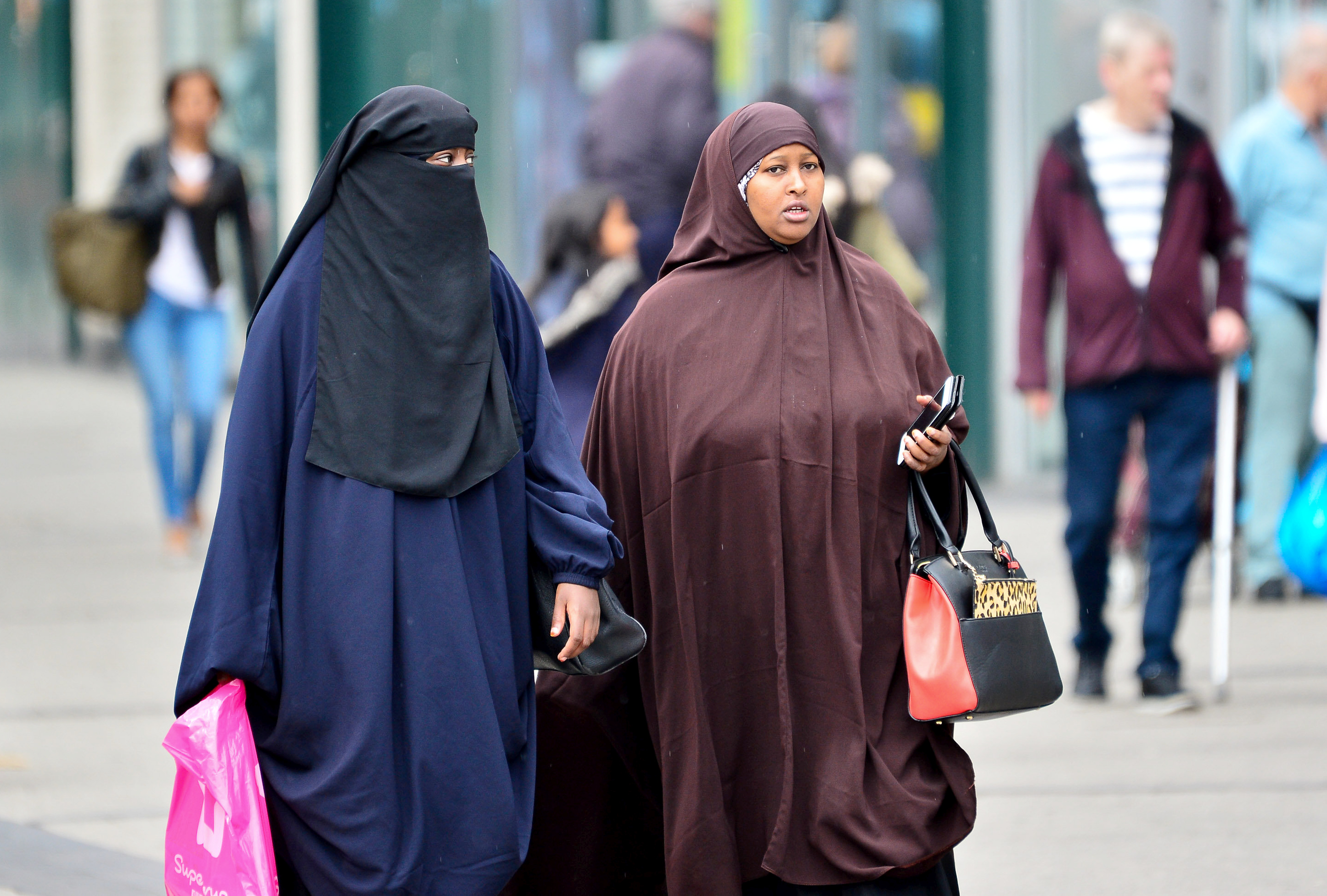 A lady wearing a Niqab (L) and Hijab (R).