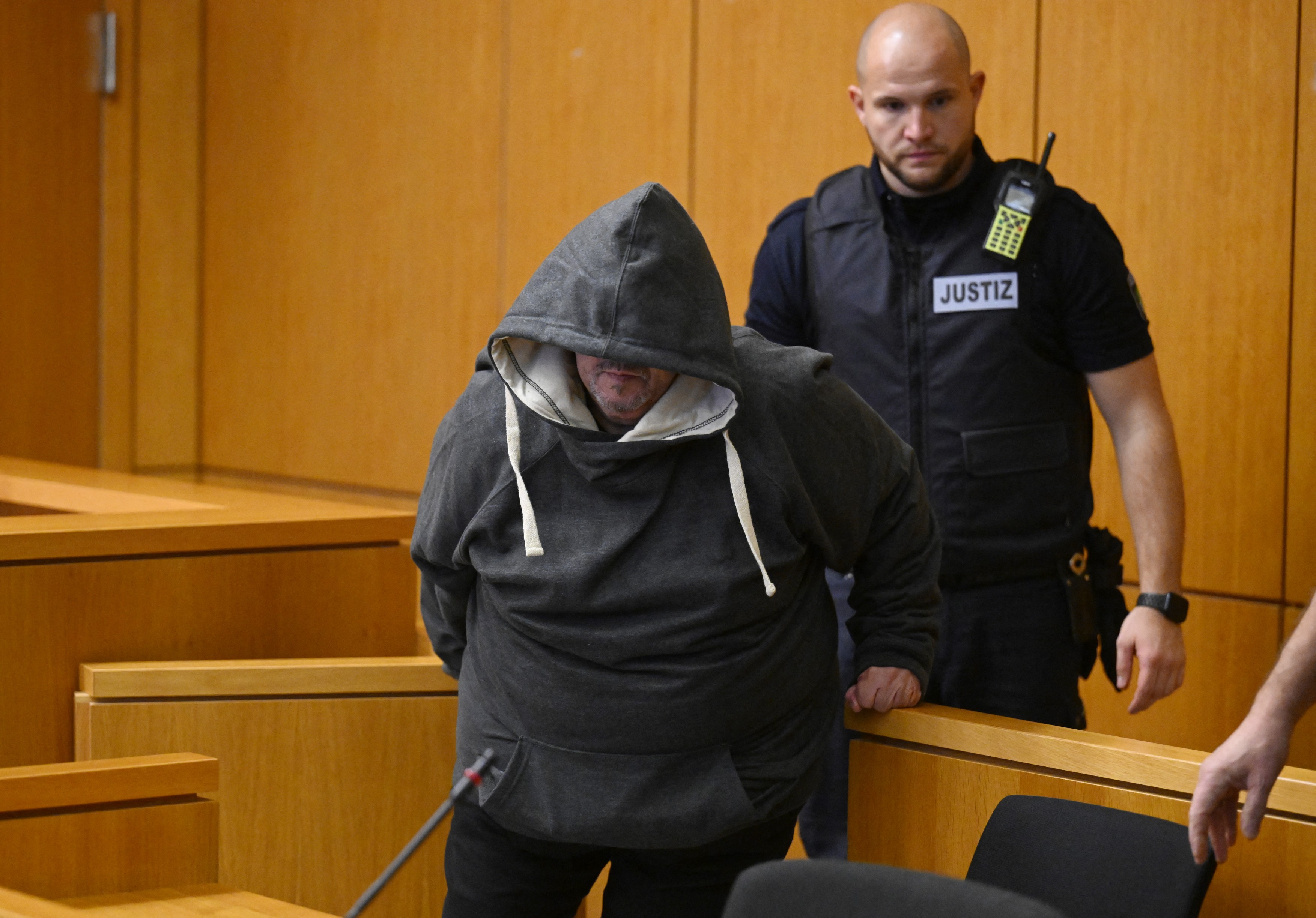 The defendant Fernando P. is escorted by a justice officer at the regional court to hear the verdict in the case where he is accused of drugging and raping his wife in Aachen, western Germany, December 19, 2025.,