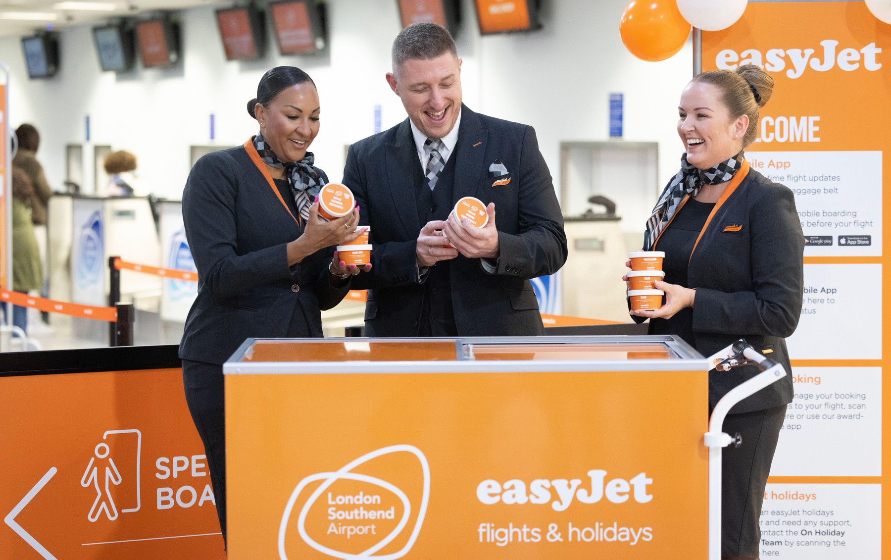 EDITORIAL USE ONLY (left to right) easyJet cabin crew easyJet Cabin Crew - Cherrelle Fox, Danny Griffiths and Danielle Rickner handing out flavoured ice cream to passengers at Southend Airport, part of a limited edition 'jet-lato' range developed by easyJ